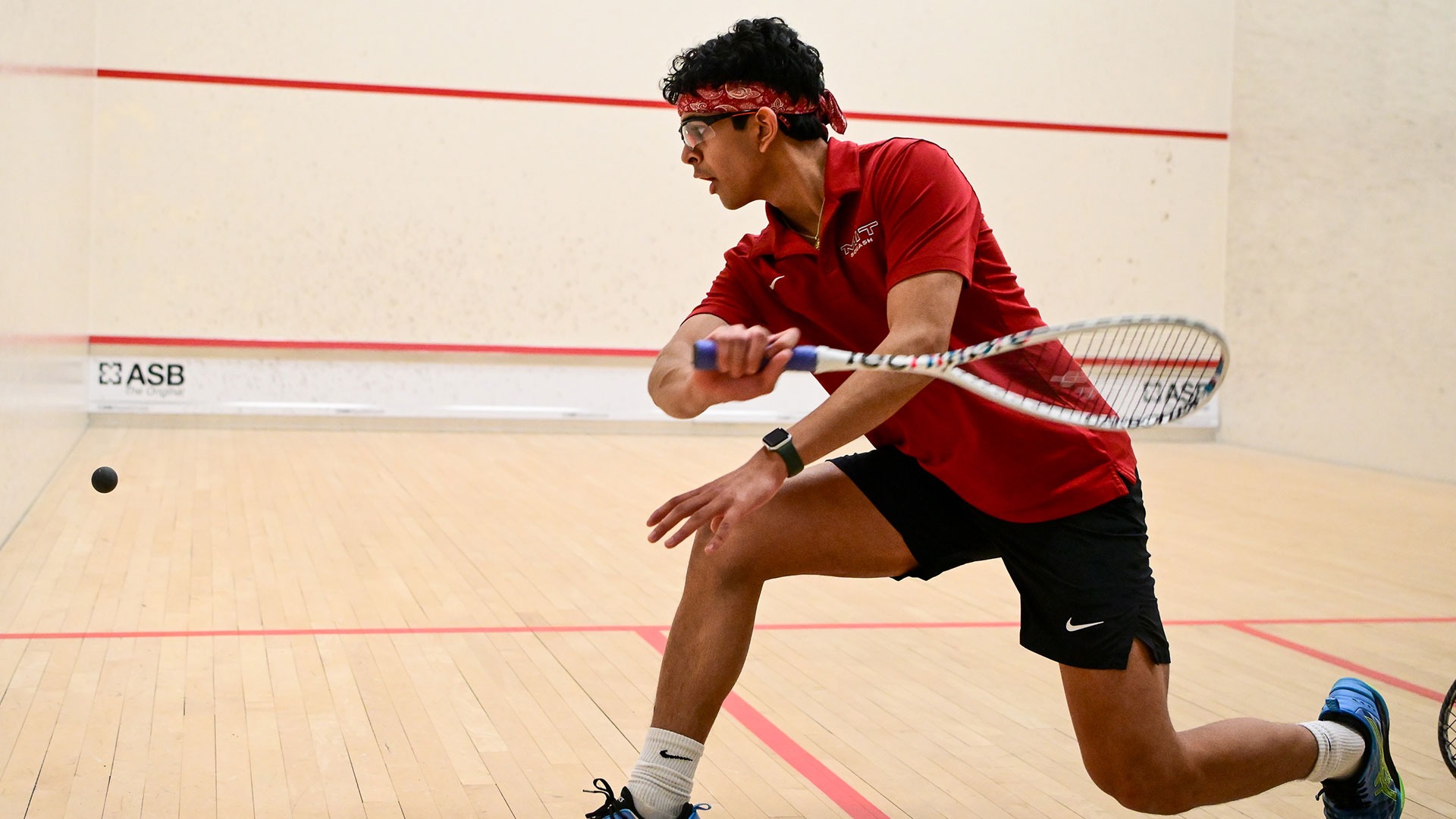 Rishabh Sharma playing squash