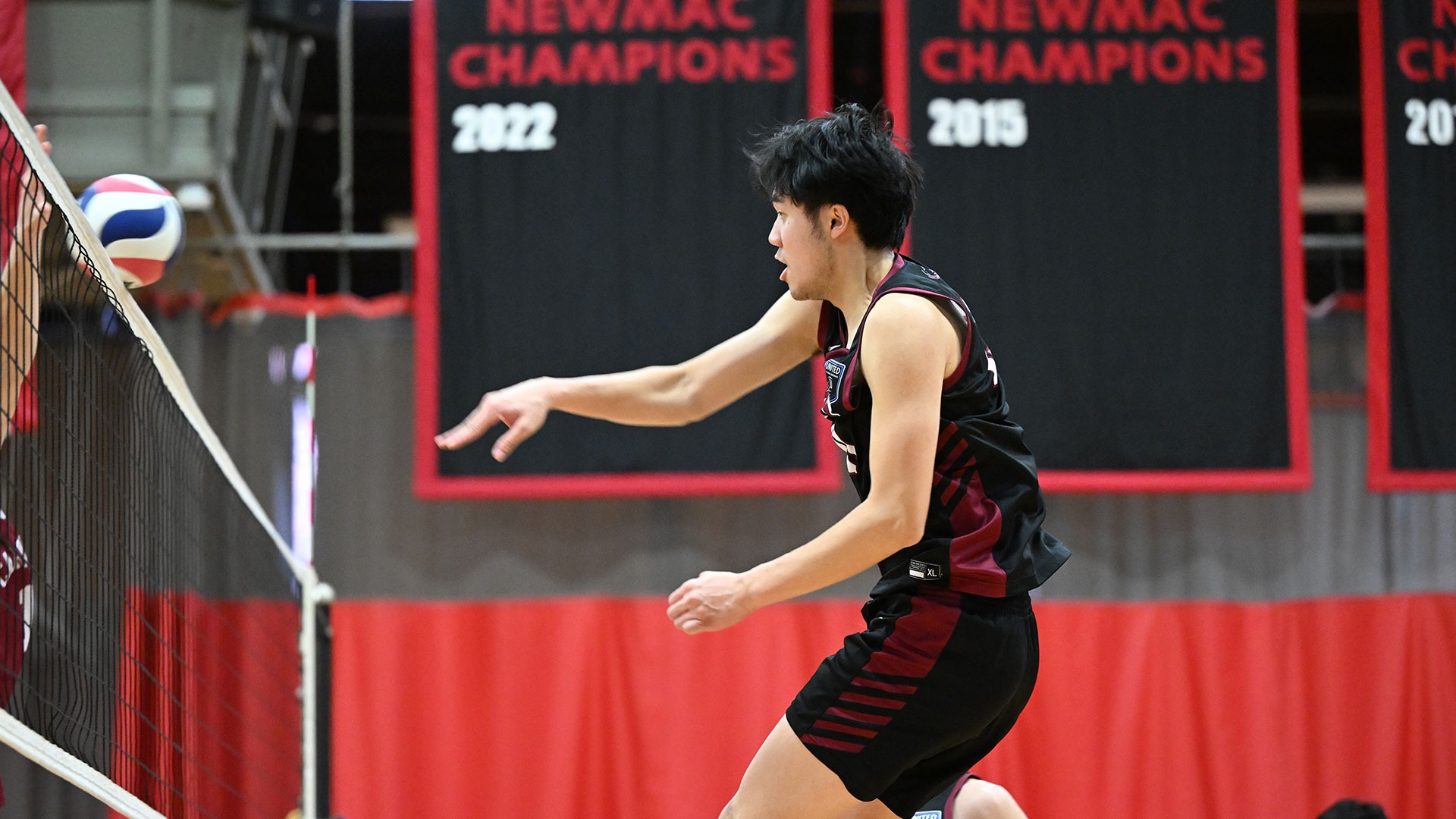 Hansen Fan hitting a volleyball over the net