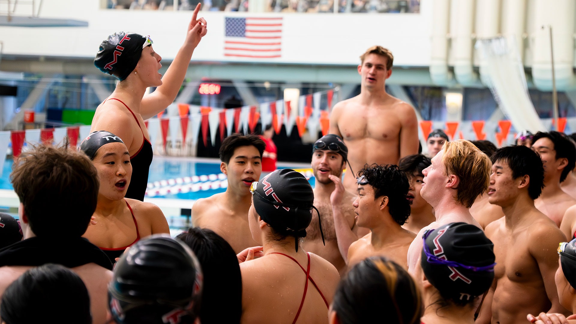 The MIT swim team together after a meet