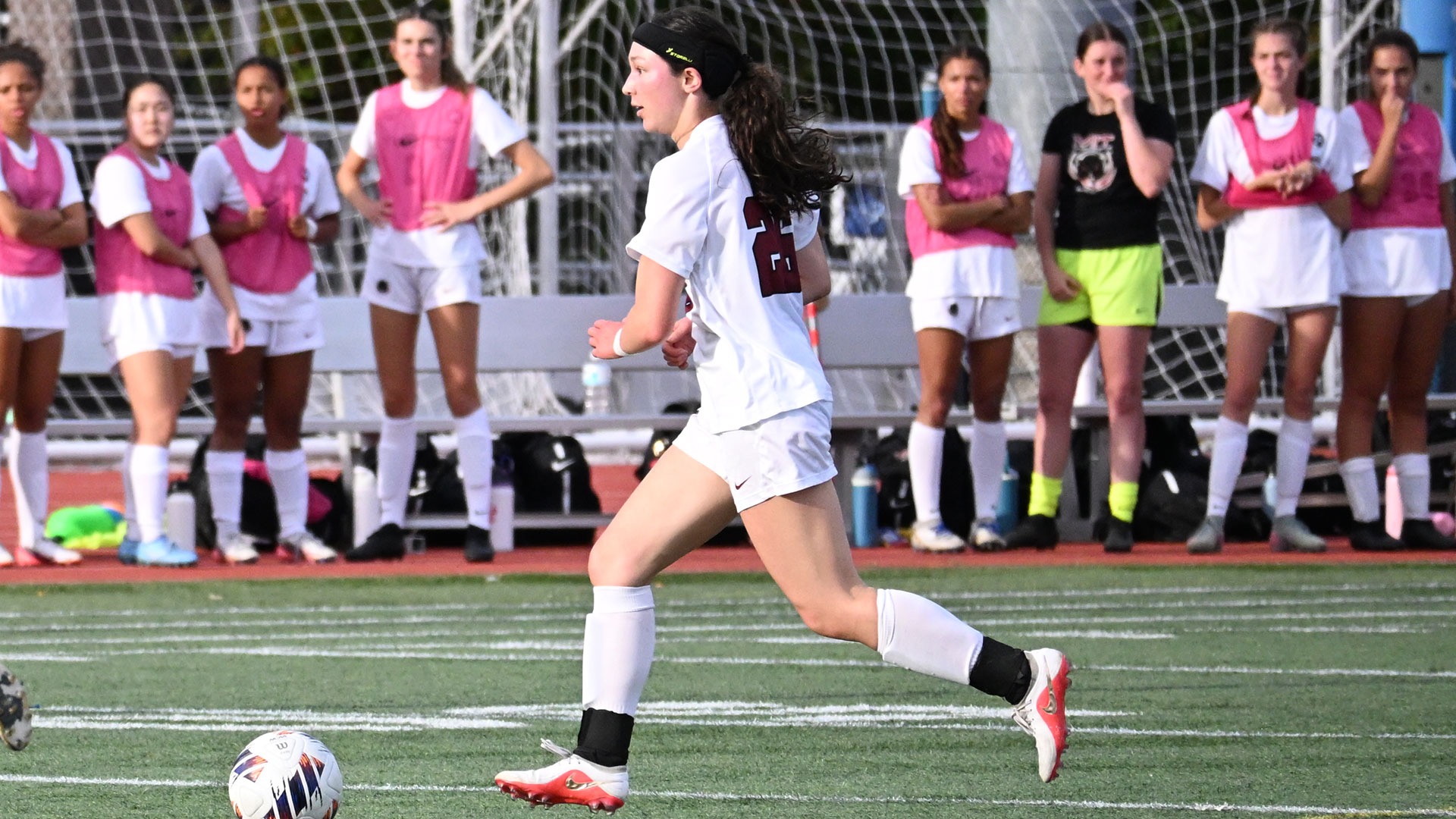Molly Mascardo dribbling the soccer ball