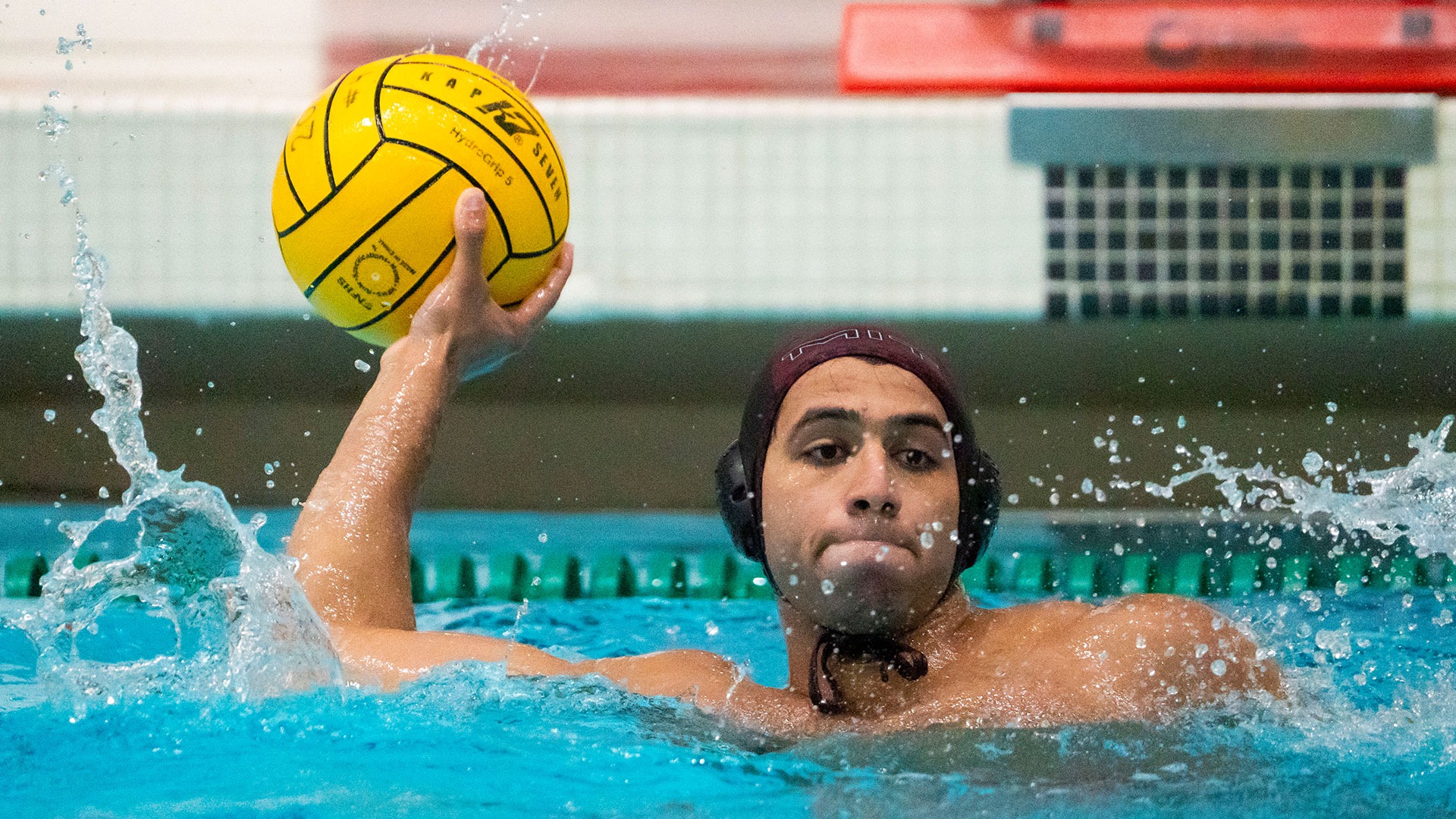 Kunal Rajadhyax looking to throw a water polo ball