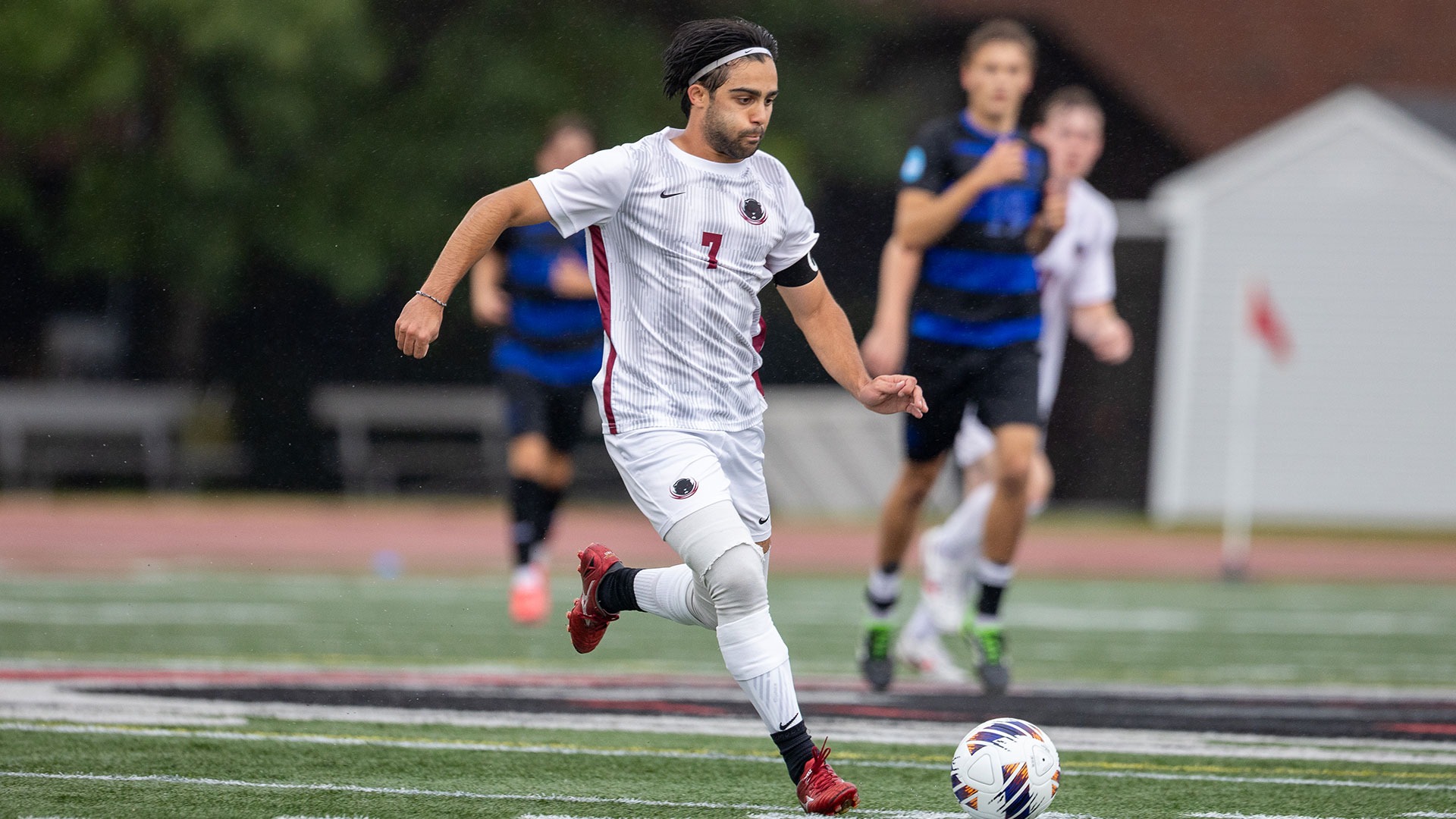 Dilin Meloni running with the soccer ball