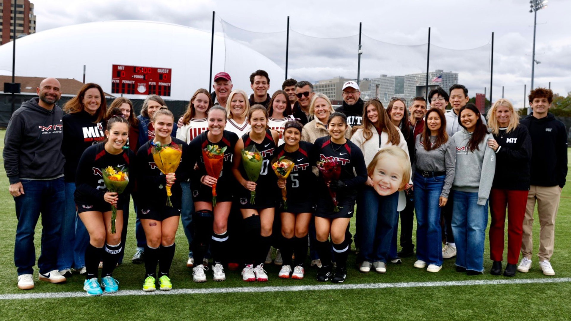 A group photo of the MIT field hockey seniors with their families