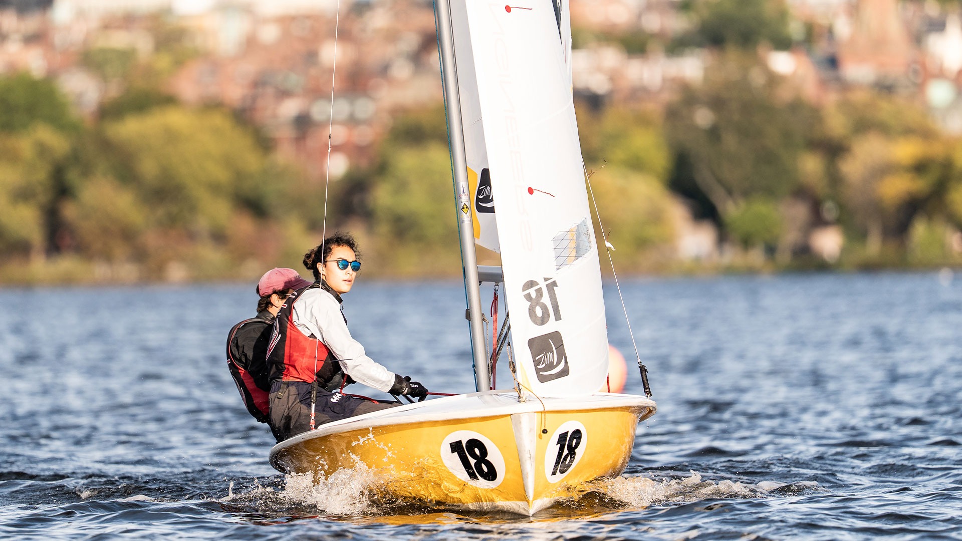 Adrian Maciuca on a sailboat on the Charles
