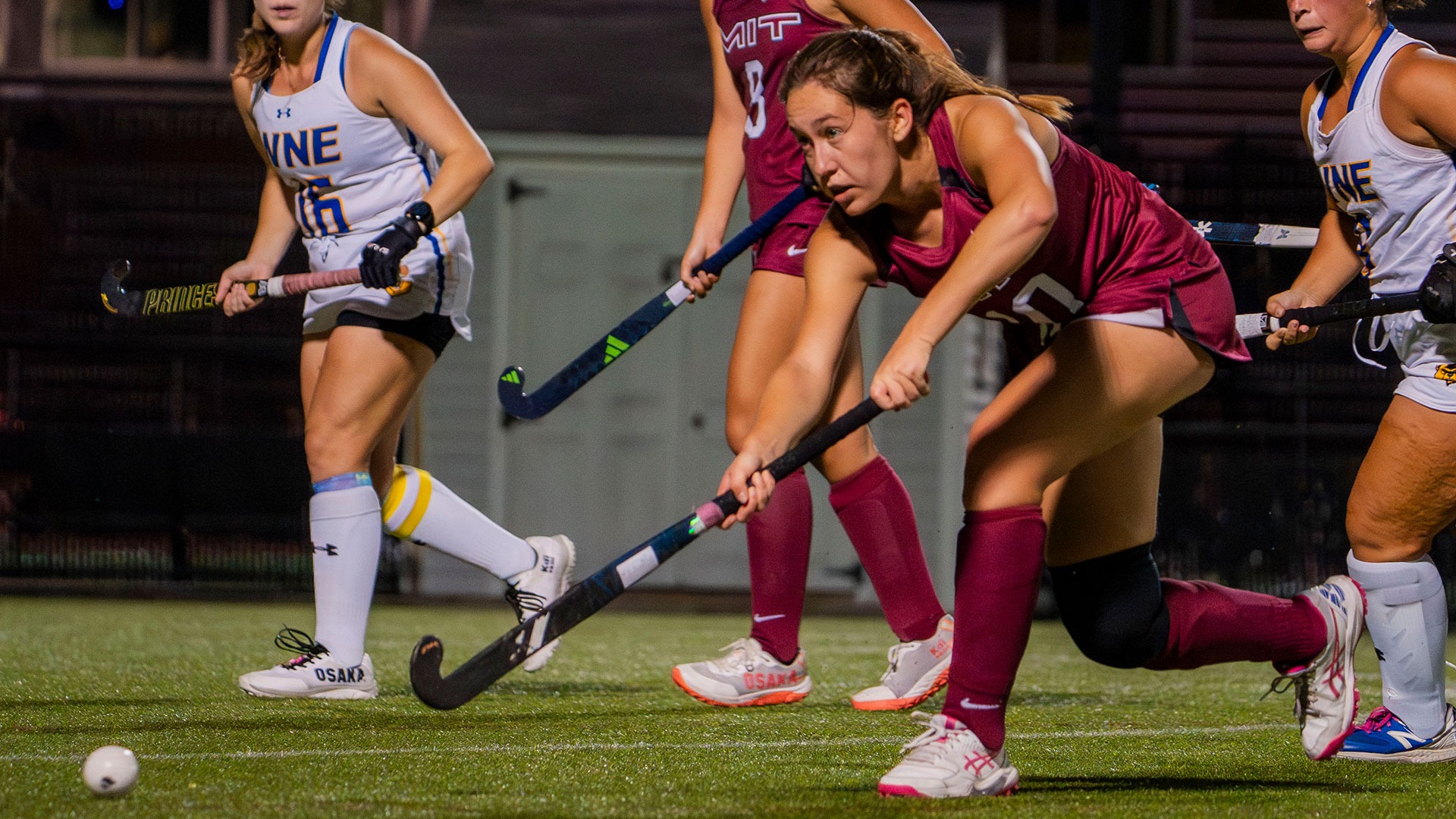 Ingrid Tomovski hitting the ball with her field hockey stick