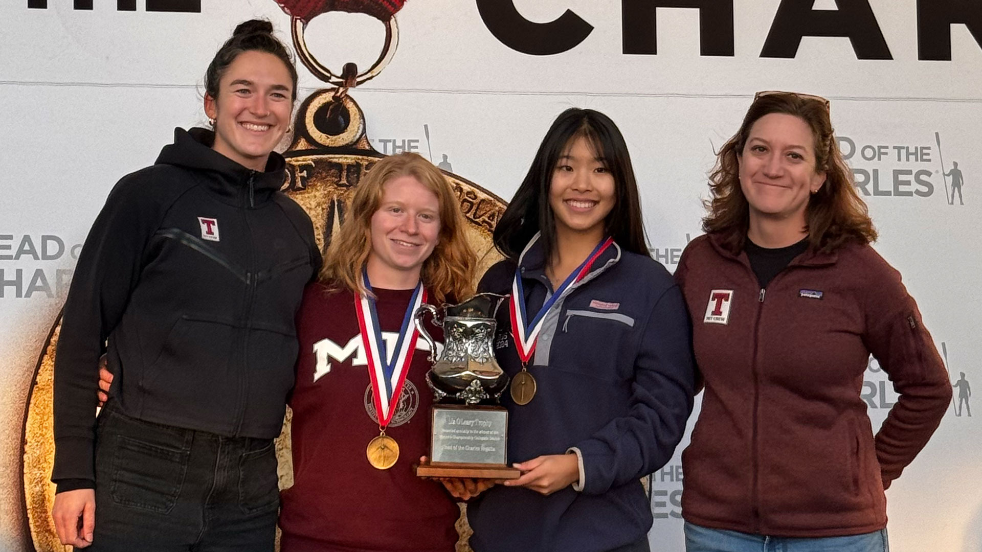 Avery Reischer-Craft and Jiwoo Oh with the Head of the Charles trophy