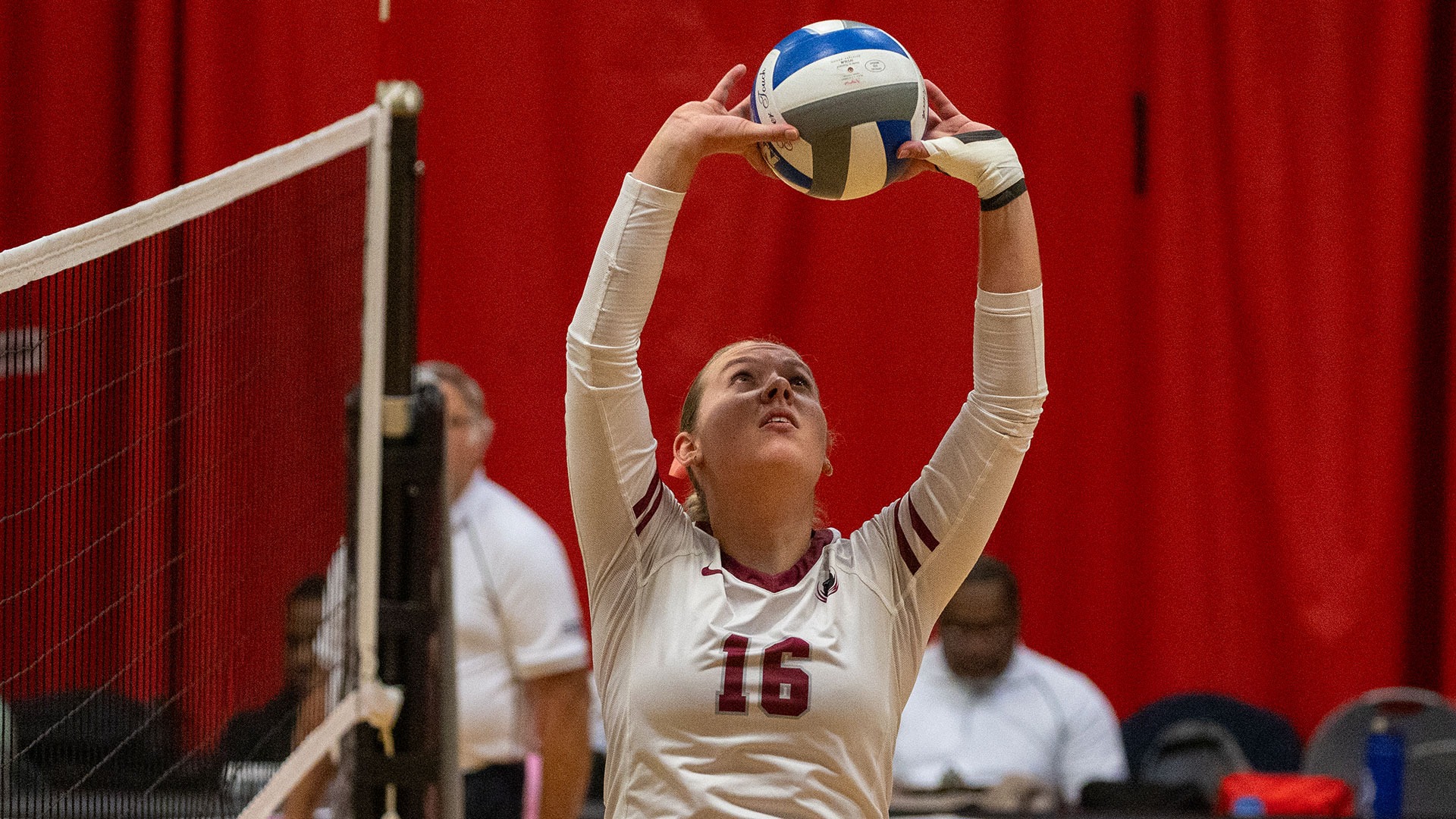 Kayleigh May setting the volleyball