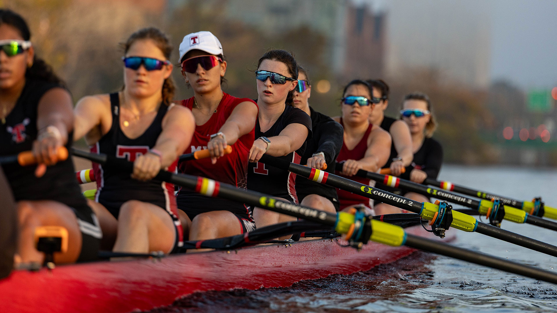 MIT varsity eight rowing on the charles river in a crew shell