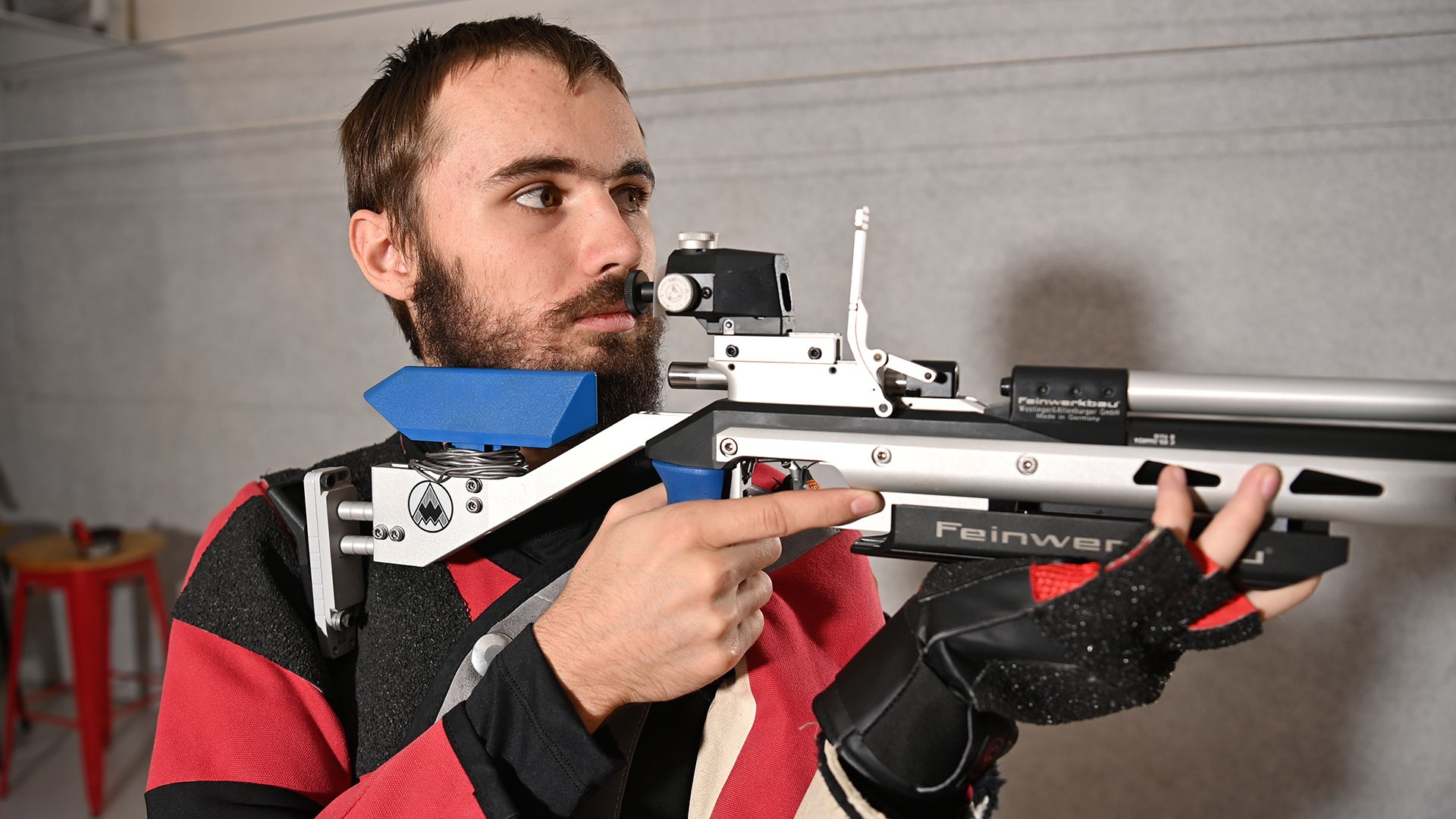William Knowlton aiming his rifle down range