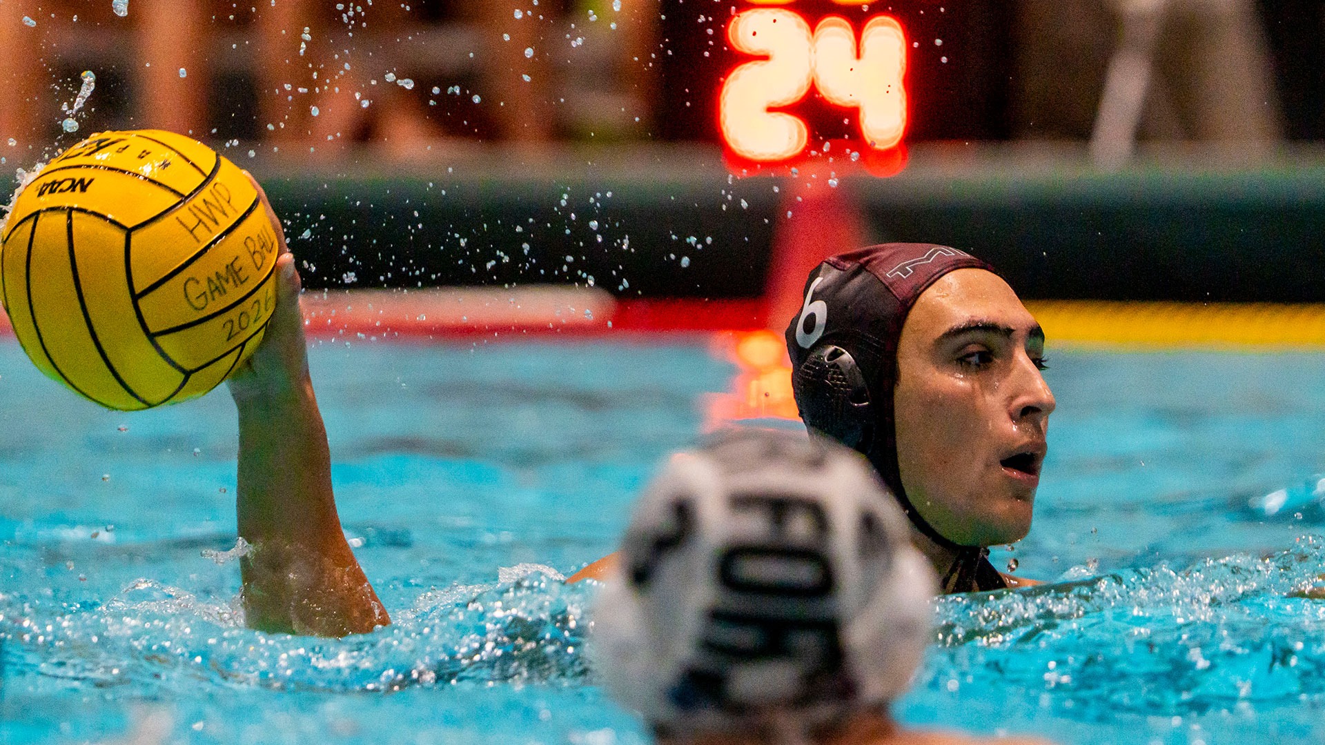 Luca Morocco holing a water polo ball