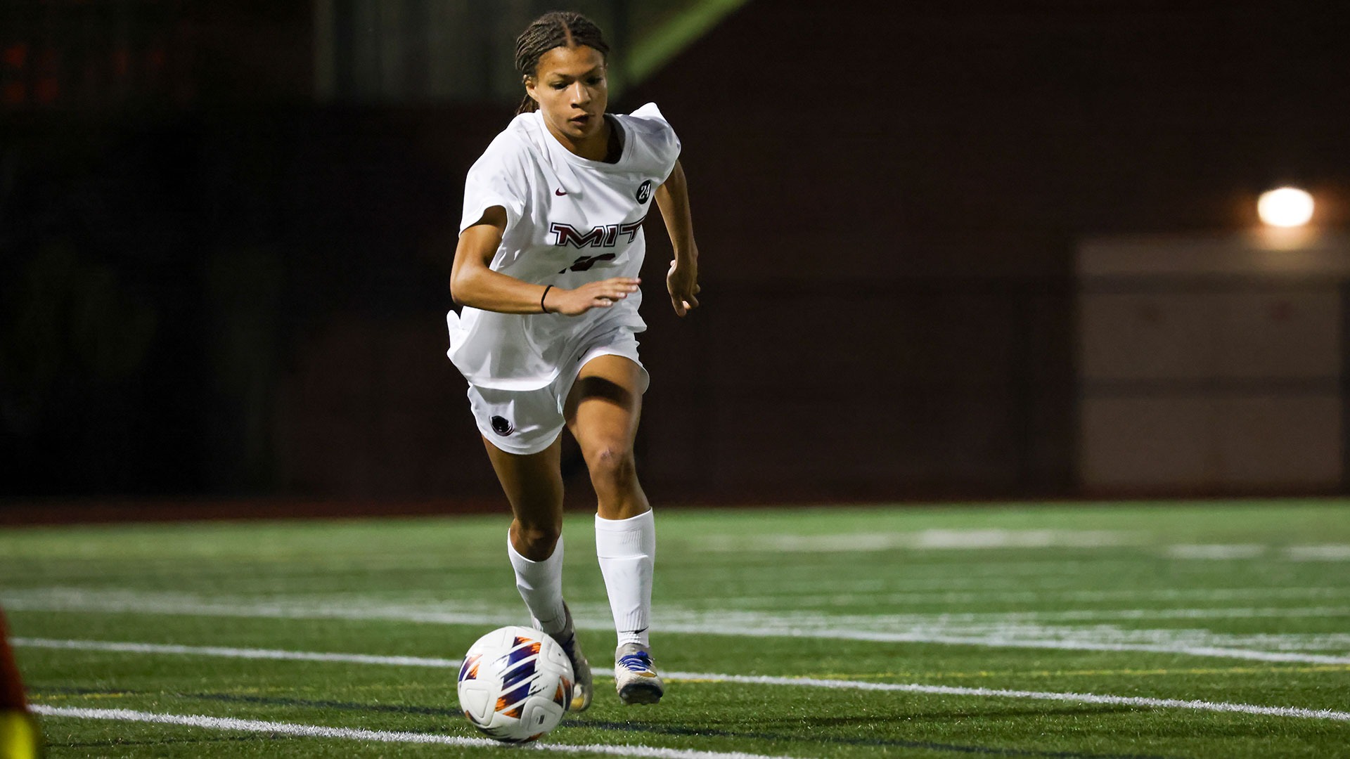 Amara Ukomadu running with the soccer ball