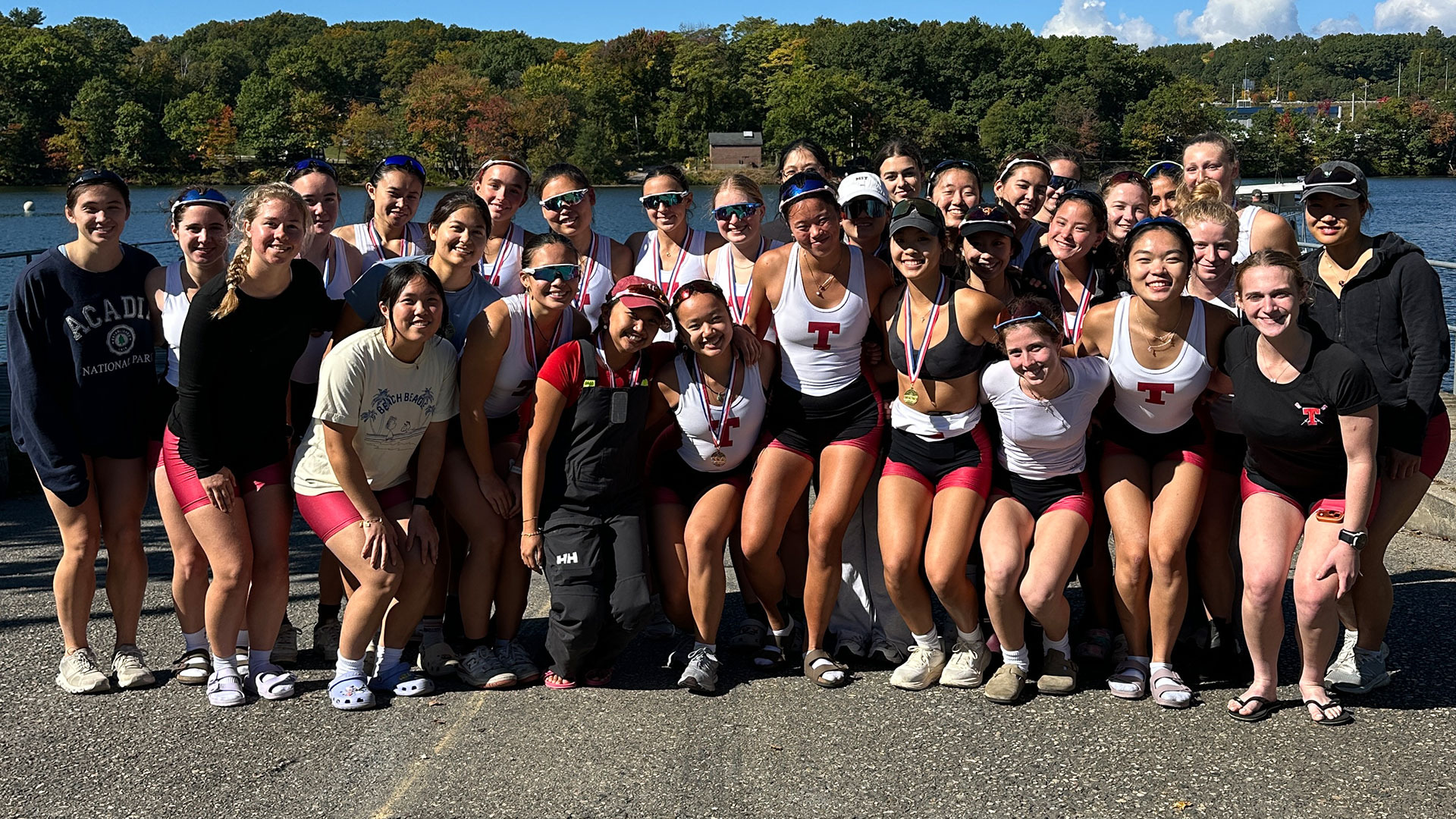 MIT women's lightweight crew team picture smiling with medals