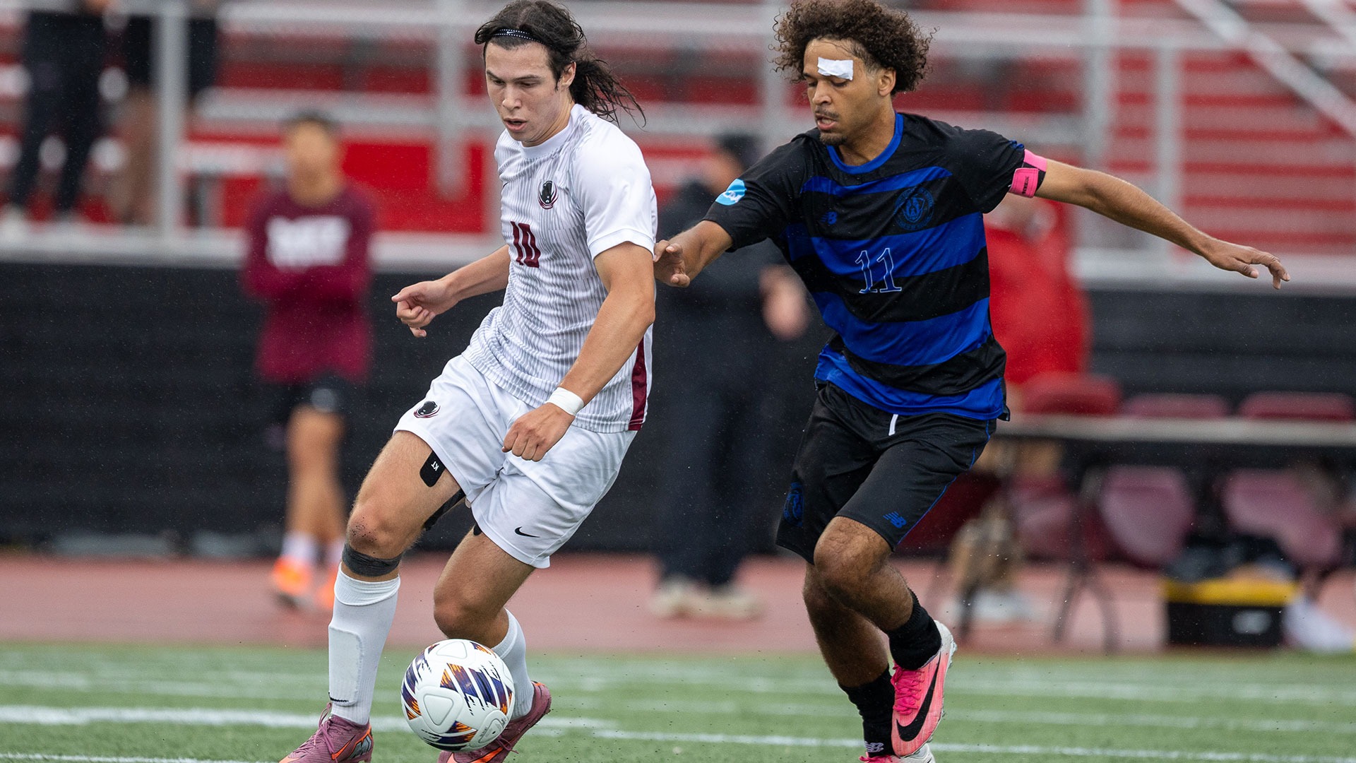 Nico Mangiafico running past a defender
