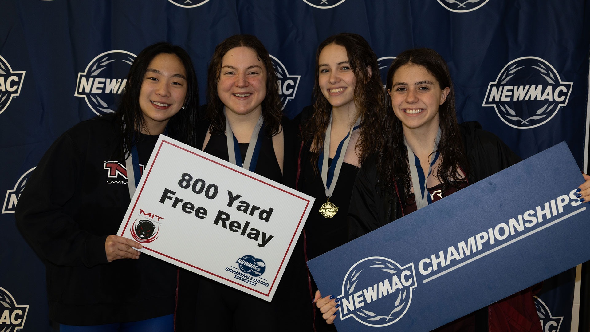 Belise Swartwood, Mary Feliz, Lillian Poag, Jessica Crane posing after winning the 800 Free Relay