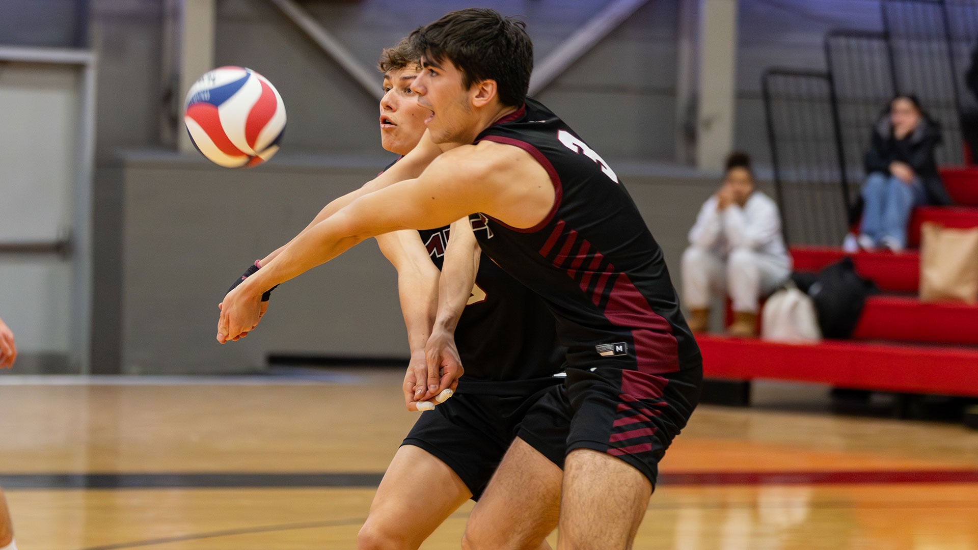 Nate Toth digging the ball