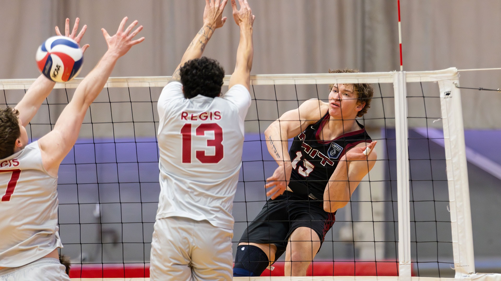 Braeden Baker hitting a volleyball