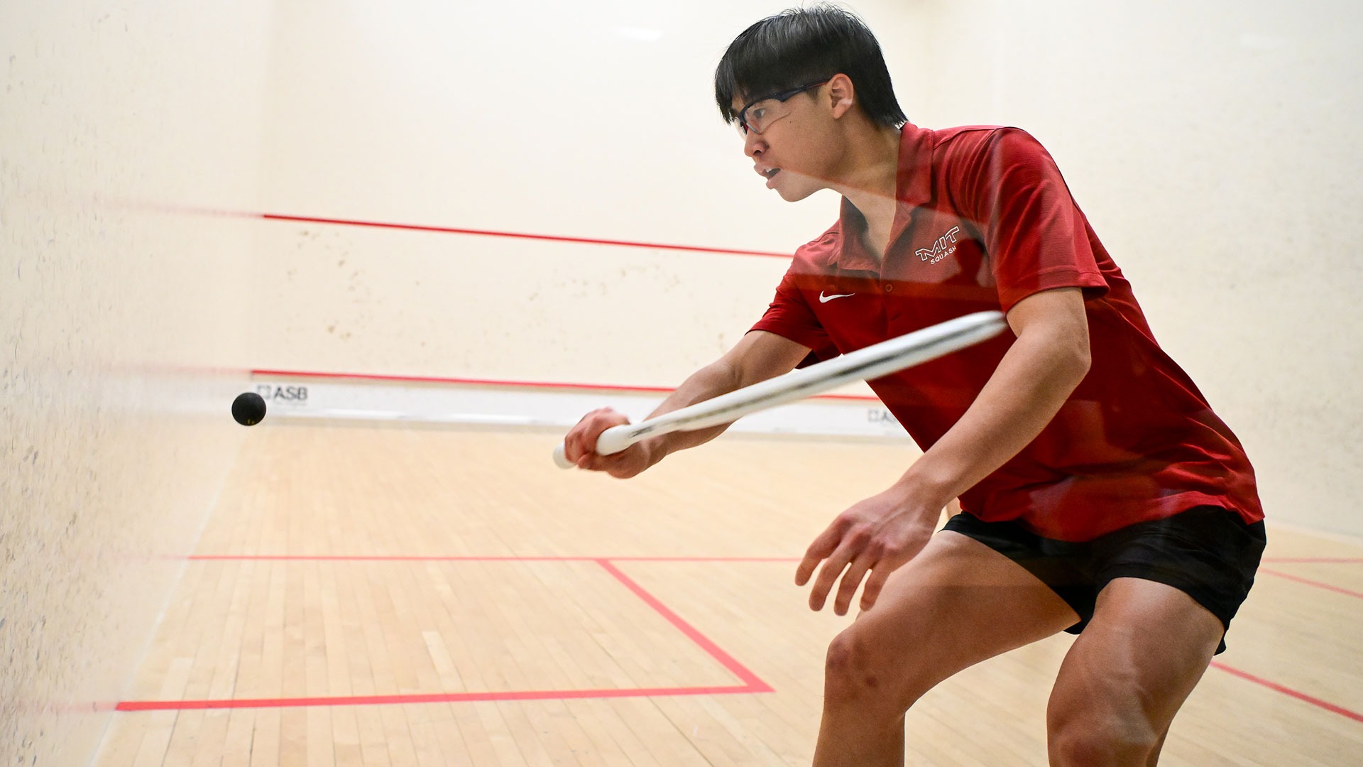 Eddie Xue hitting a ball