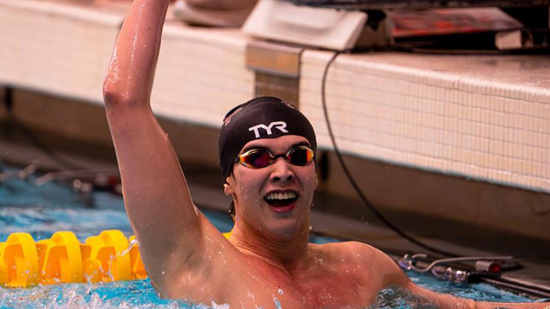 Evan Wong celebrating after a race