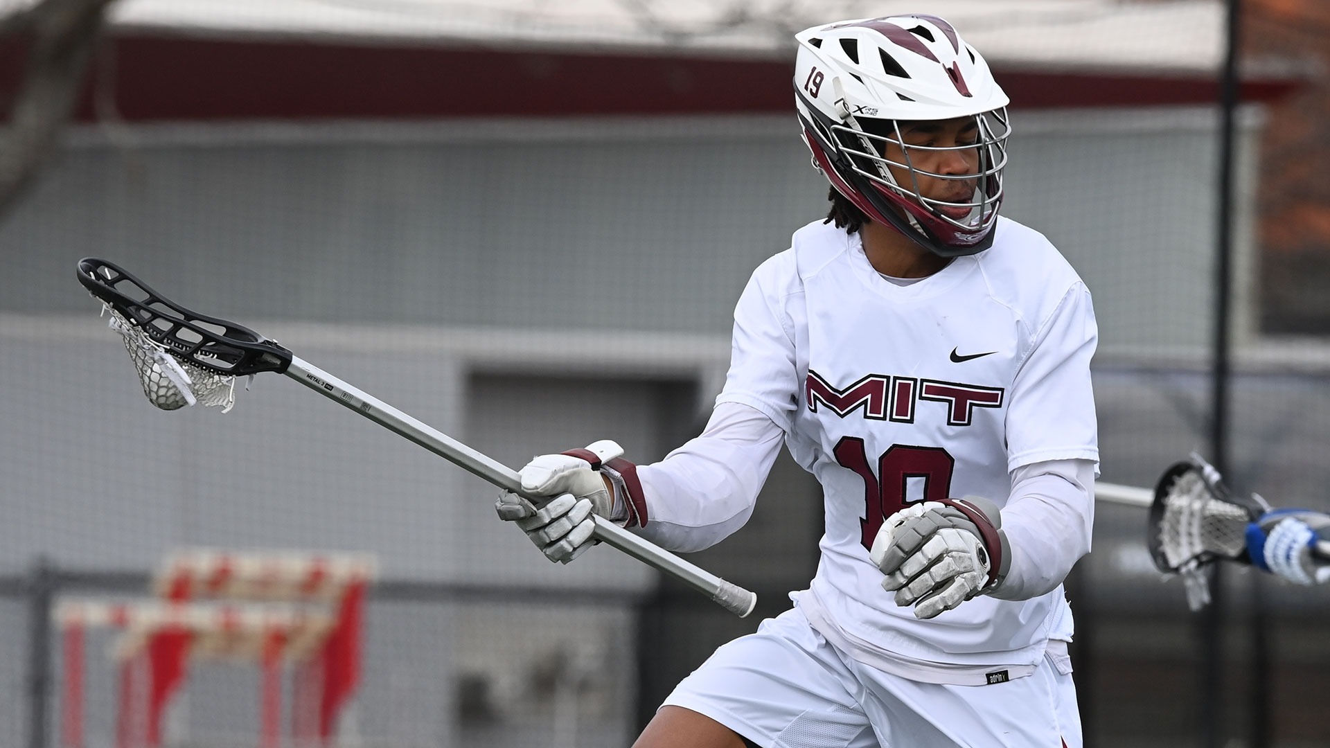 Riley Pierce holding his lacrosse stick