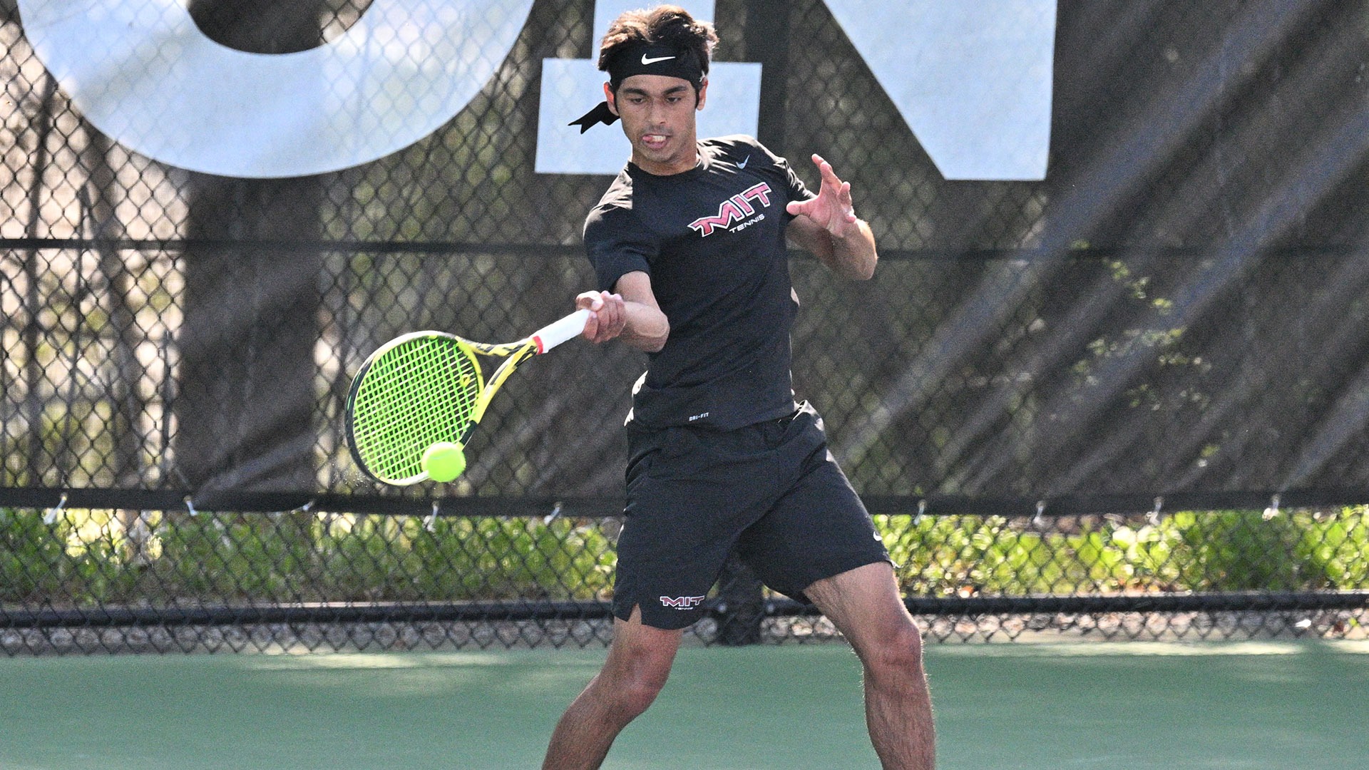 Shrish Choudhary hitting the tennis ball on a forehand
