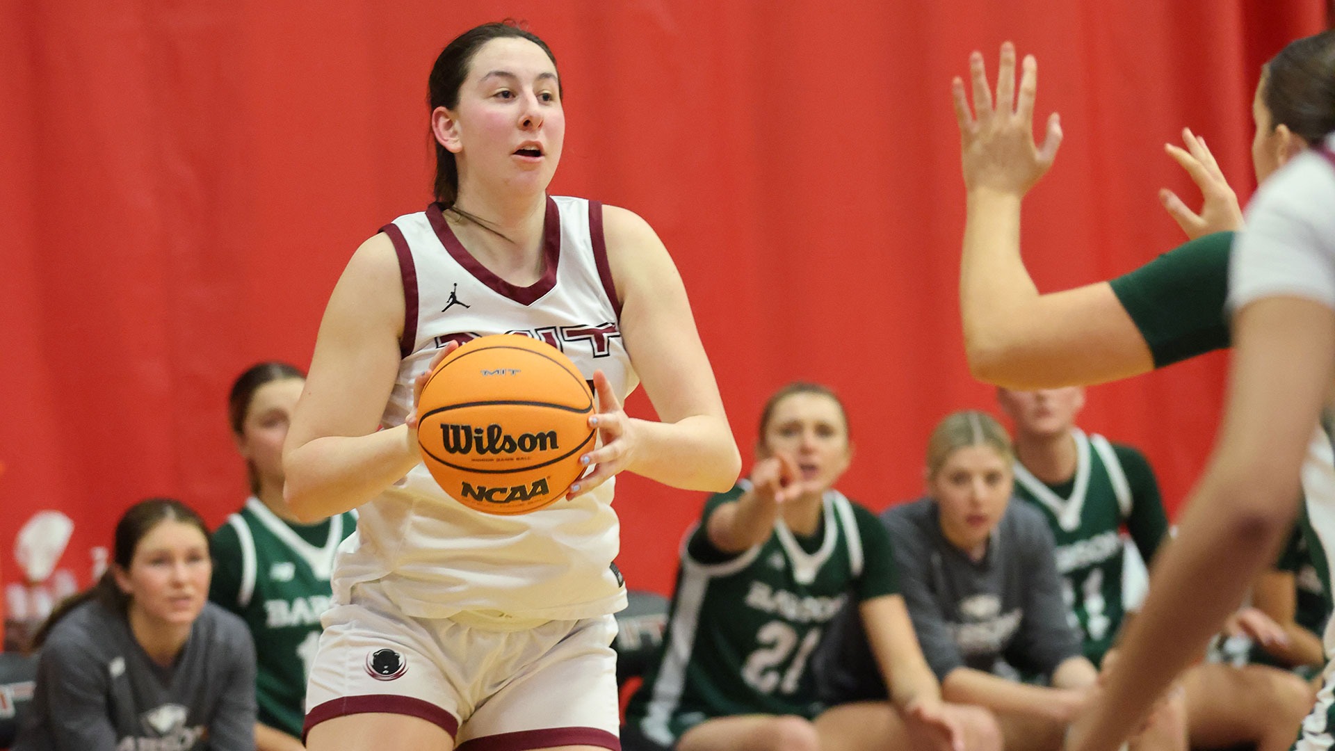 Riley O'Sullivan holding a basketball