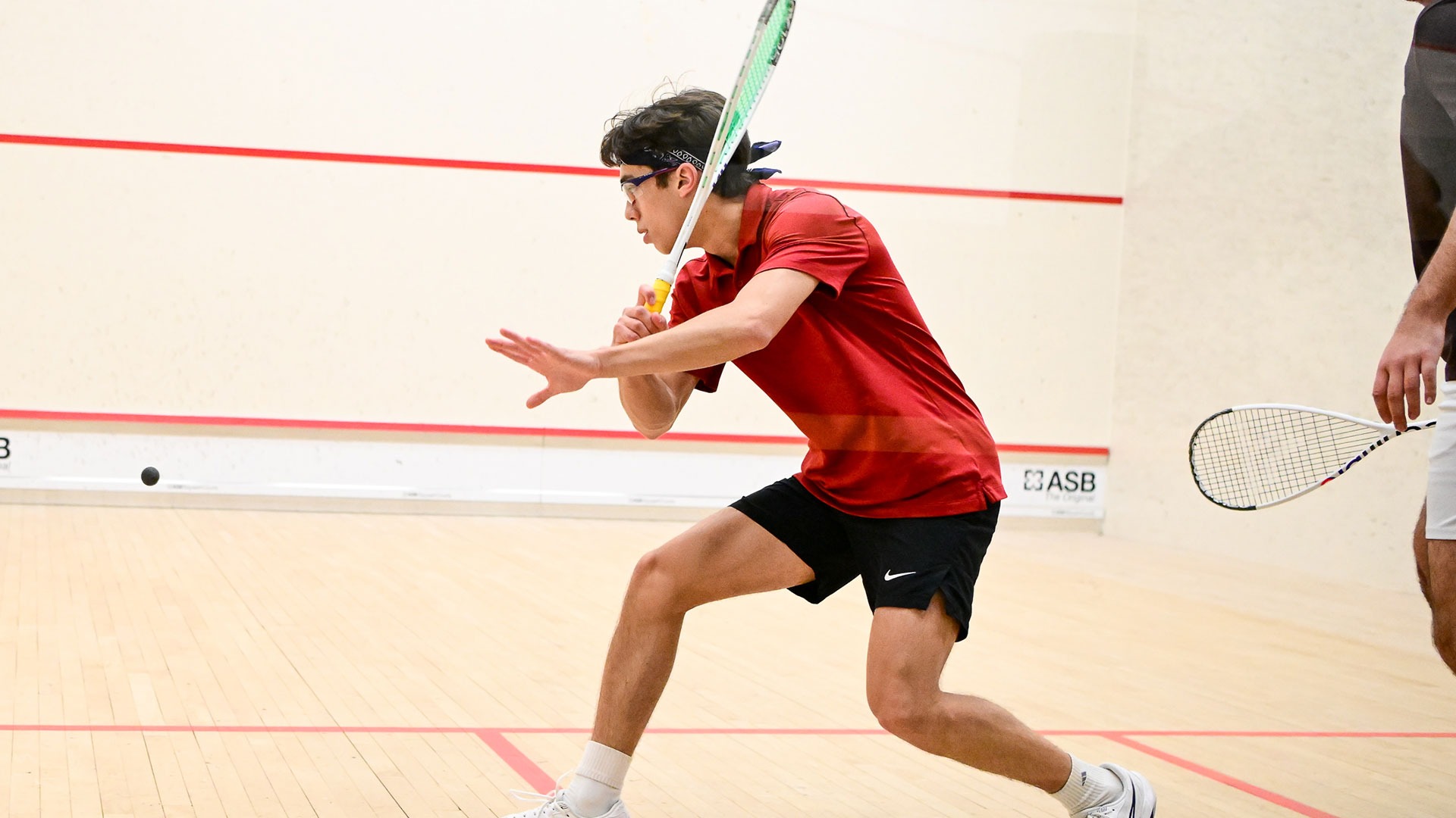 Zachary Starr playing squash