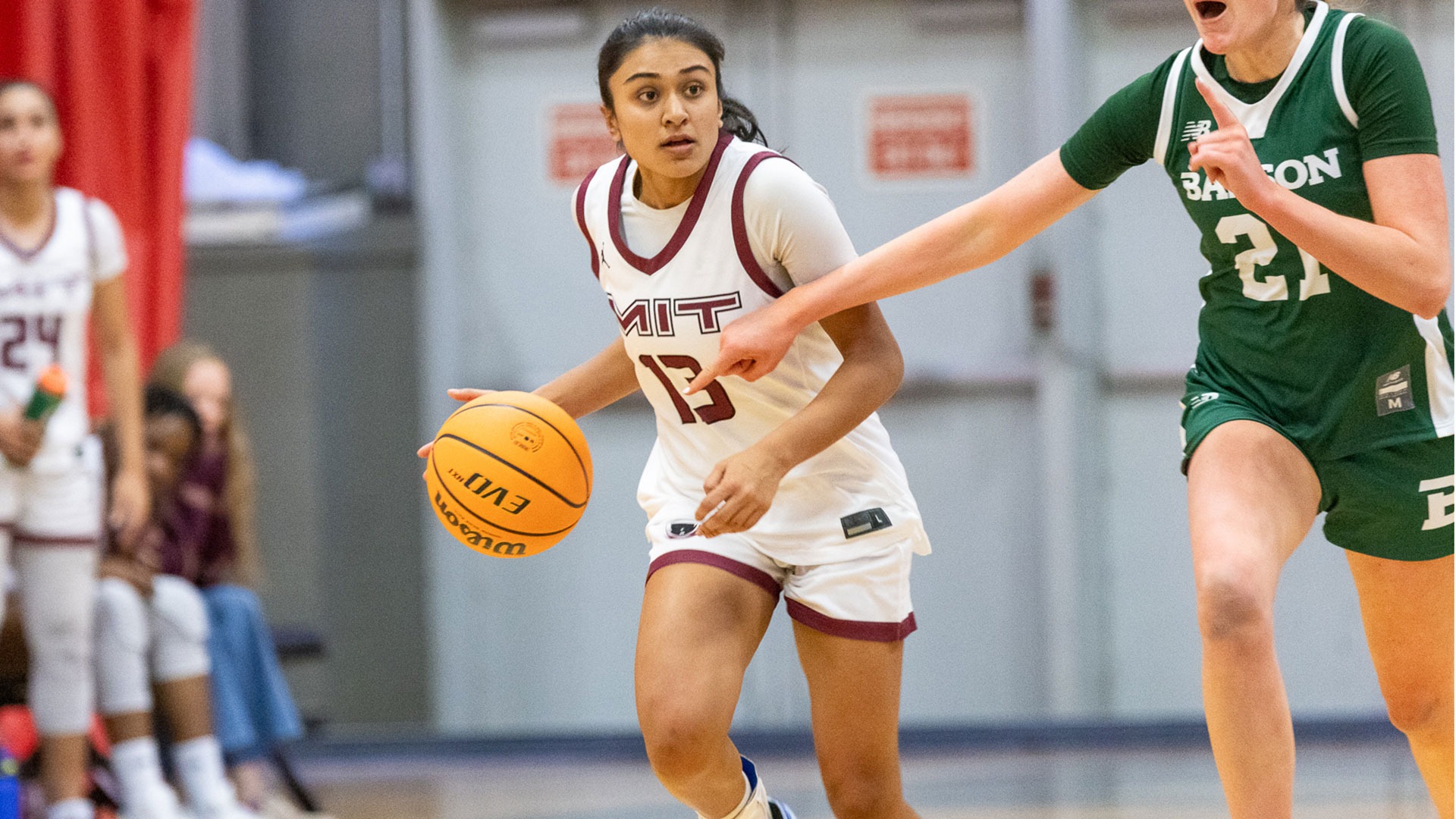 Deana Prasad dribbling the basketball down the court