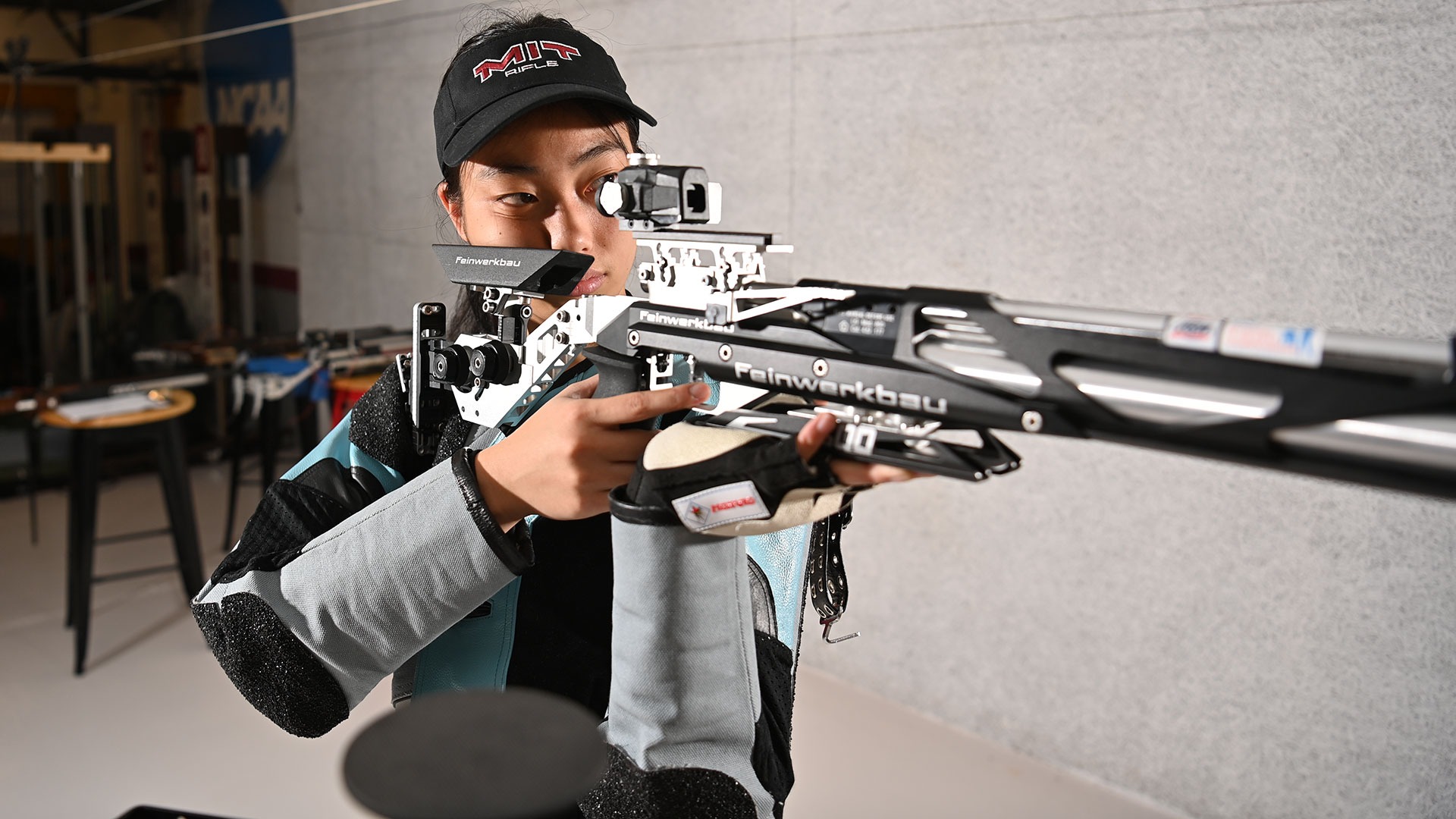 Eleanor Yang aiming her rifle down the range