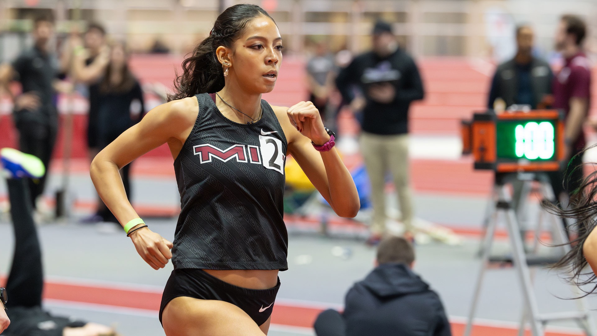 Krystal Montgomery running on a track