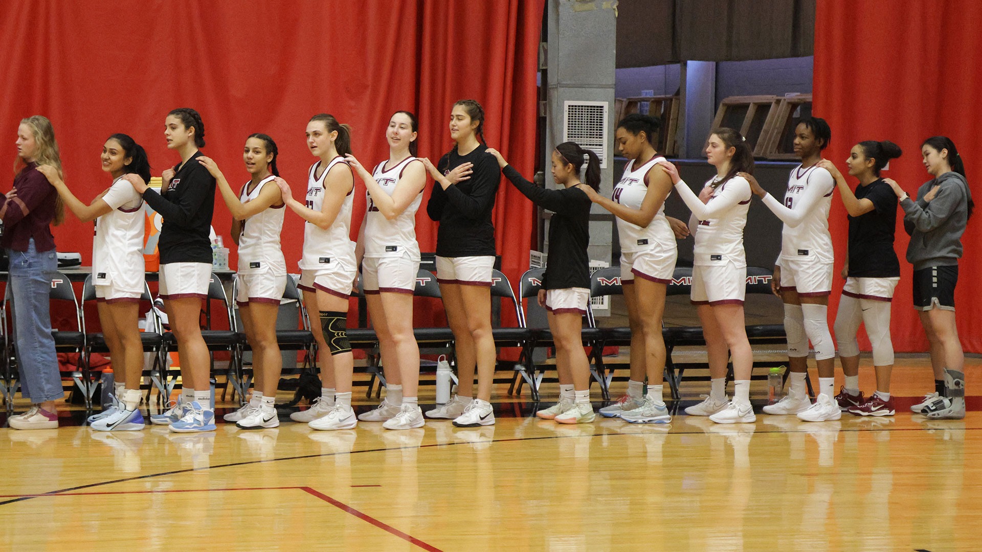 Women's basketball team standing in a line
