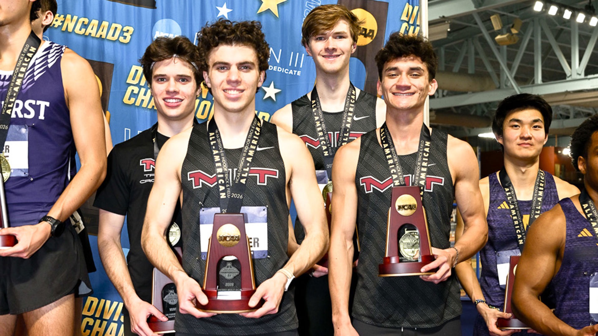 Tim Neumann, Davis Lee, David Whitaker, and Jared Steins on the podium