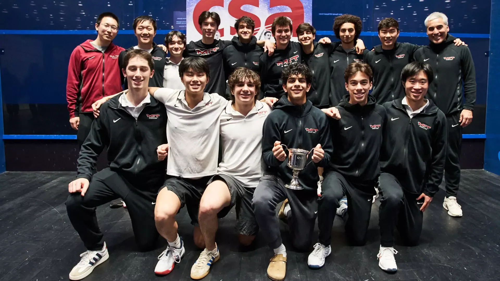 The MIT Squash Team group photo with the championship trophy