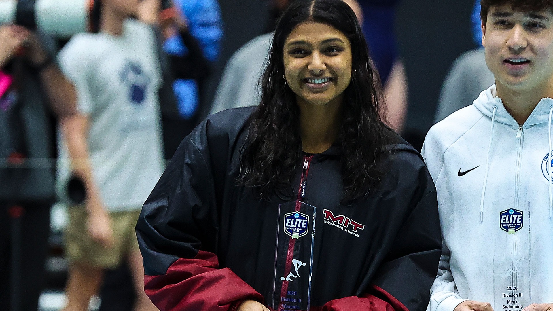 Annika Naveen holding the NCAA Elite Scholar Athlete Award