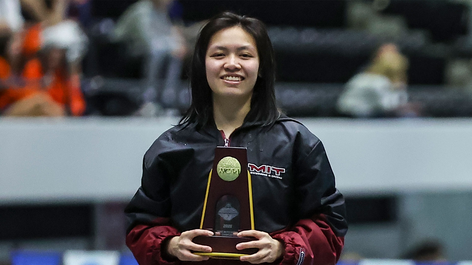 Fiora Beratahani holding her national championship trophy