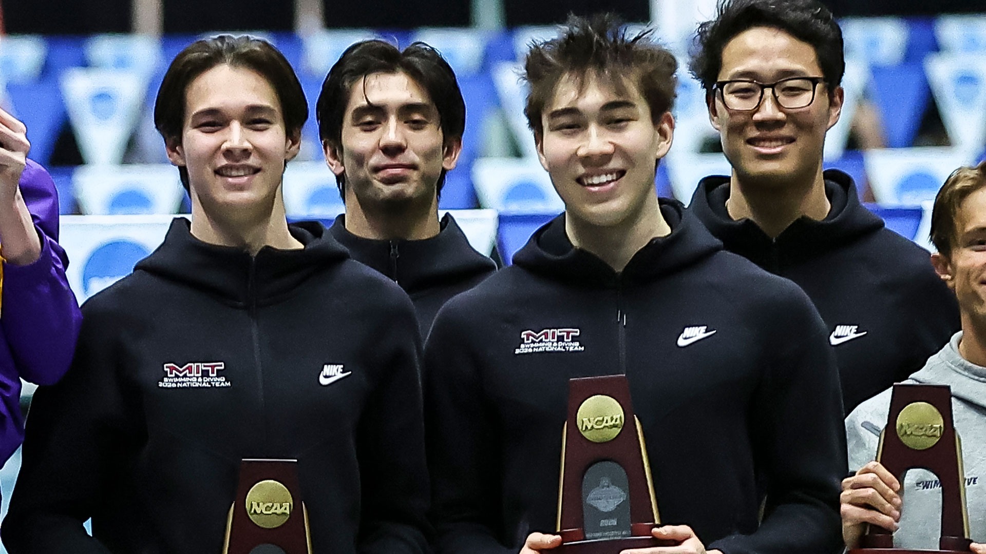 Aaron Martin, Bryce Roberts, Evan Wong, and Nathan Kim with NCAA Championship trophy