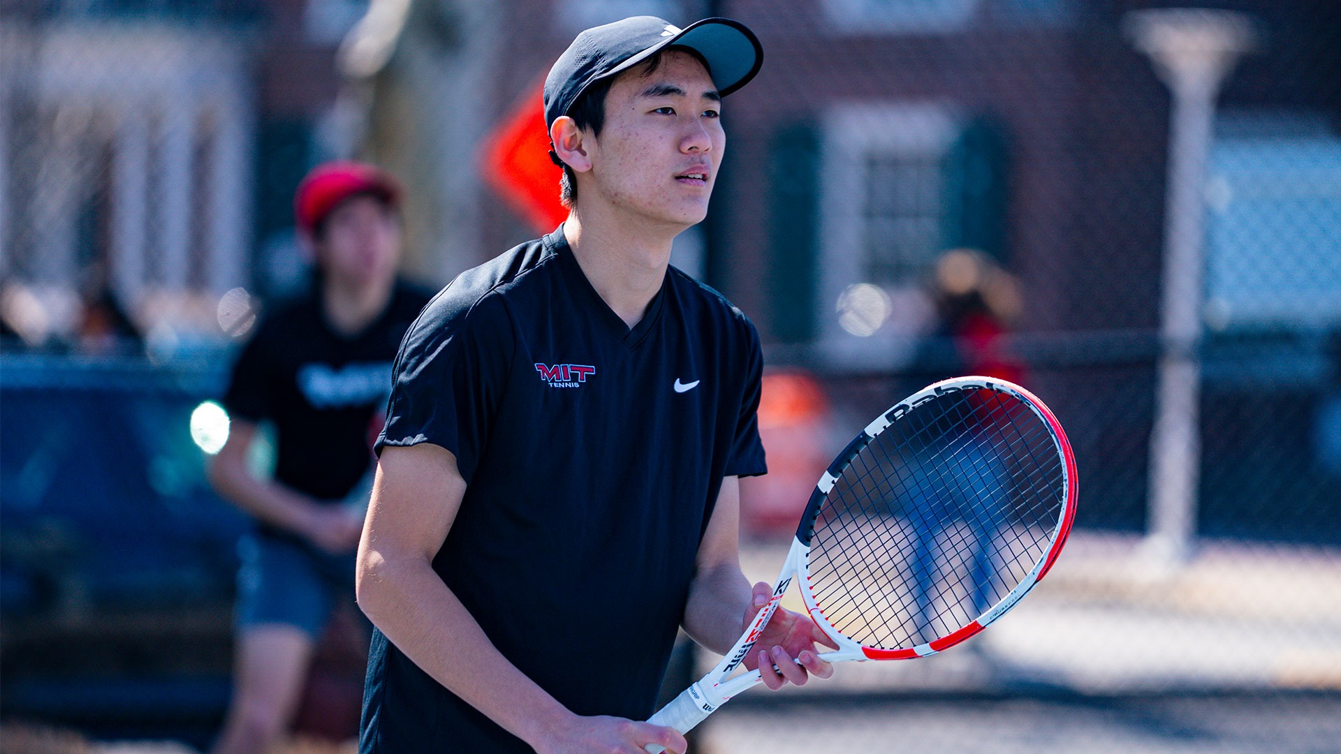 Tyler Li waiting for a serve