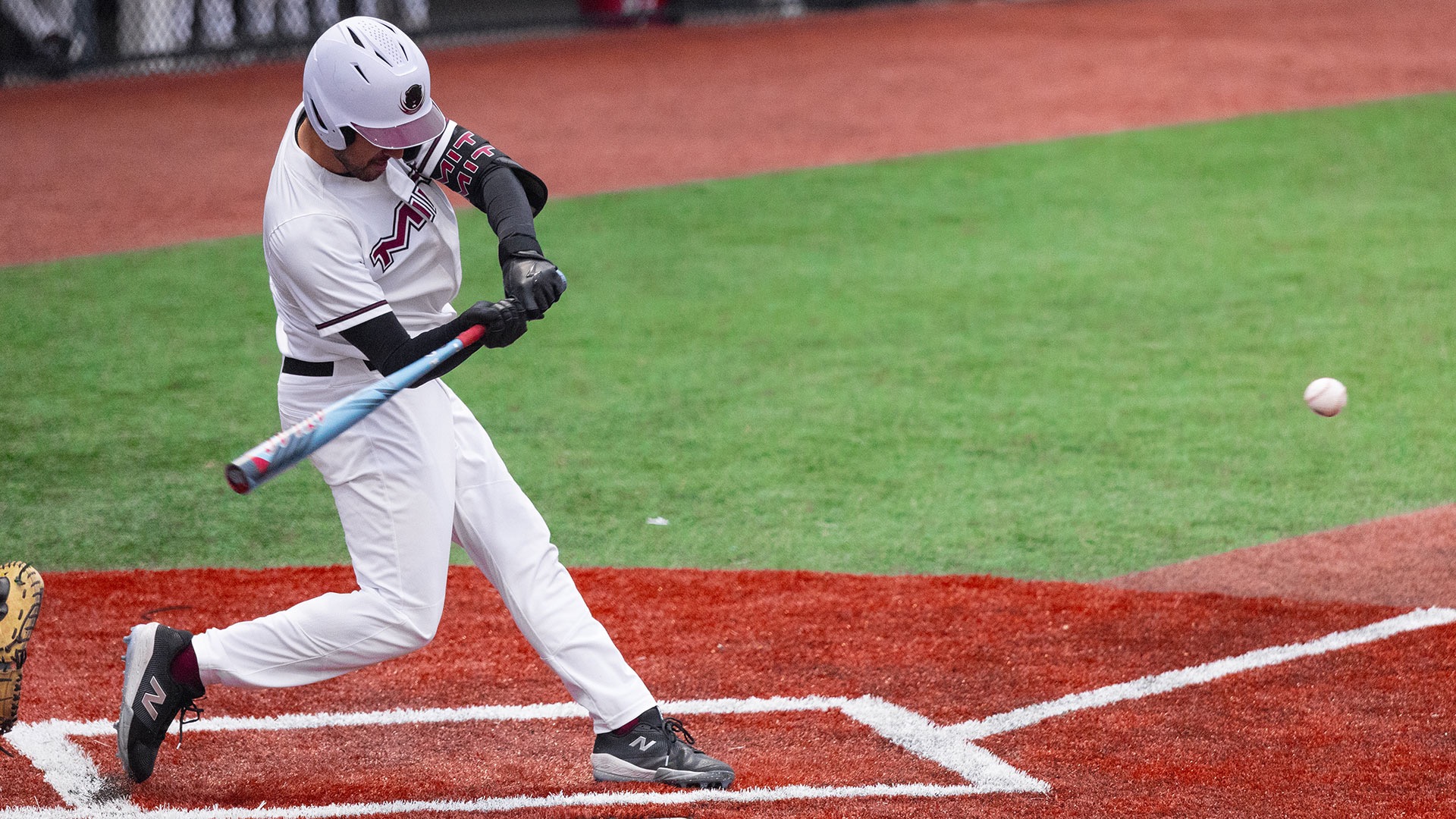 Maximo Del Pino hitting a baseball