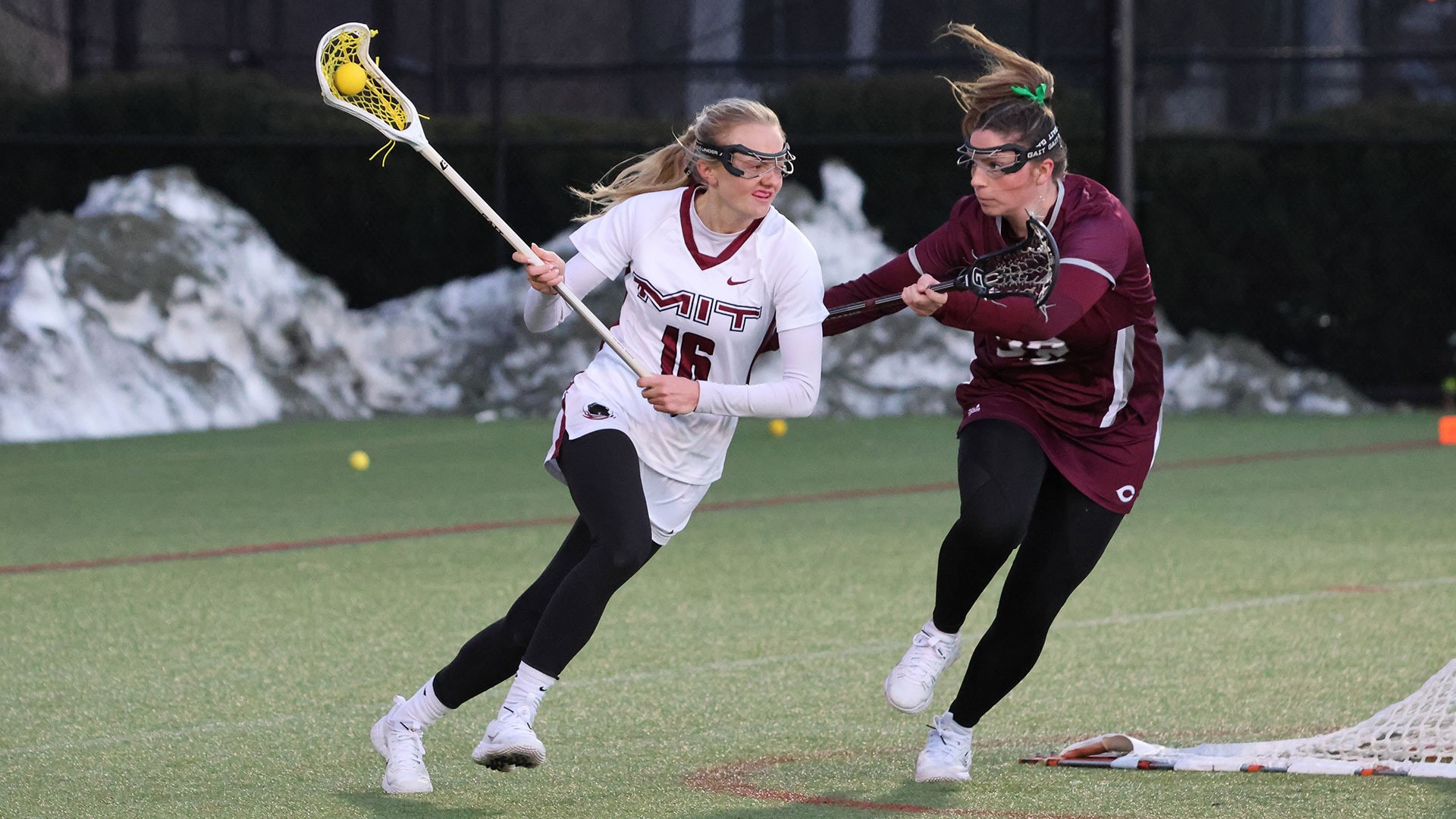 Ashley Thomas running past a defender