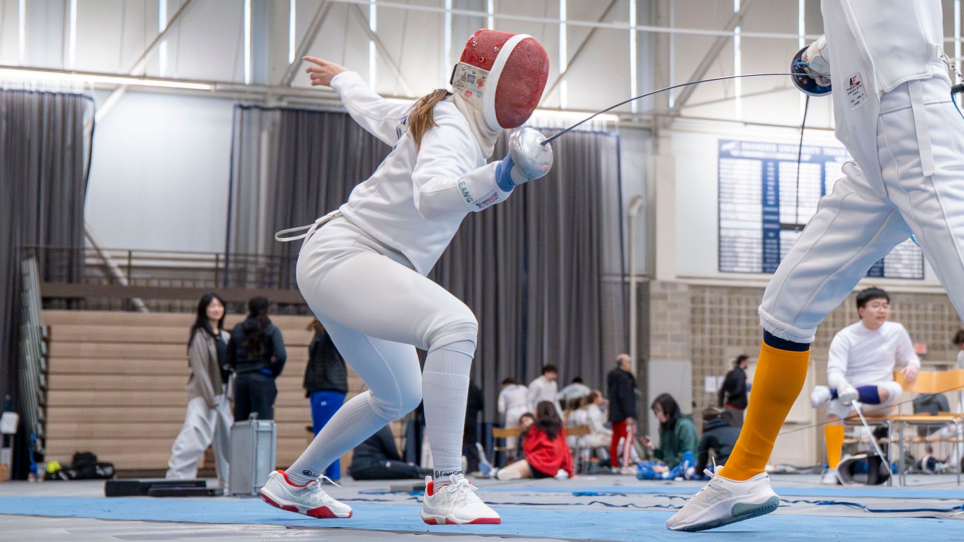 Priscilla Leang lunging towards her opponent