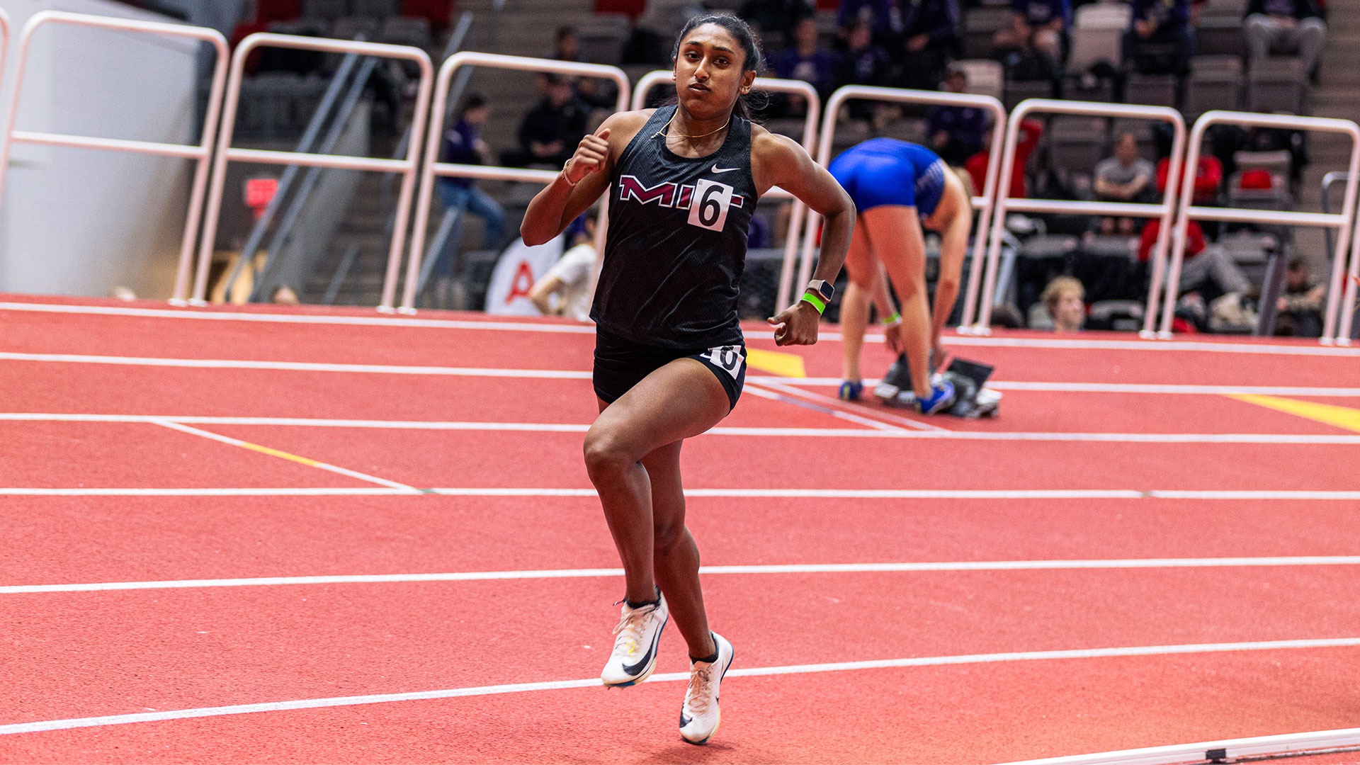 Shreya Kayan running on a track