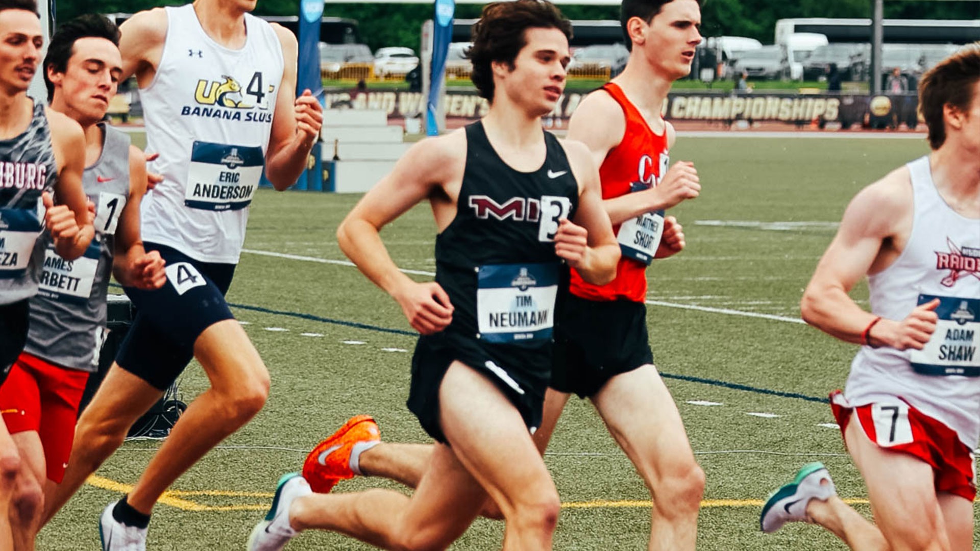 Tim Neumann running on a track