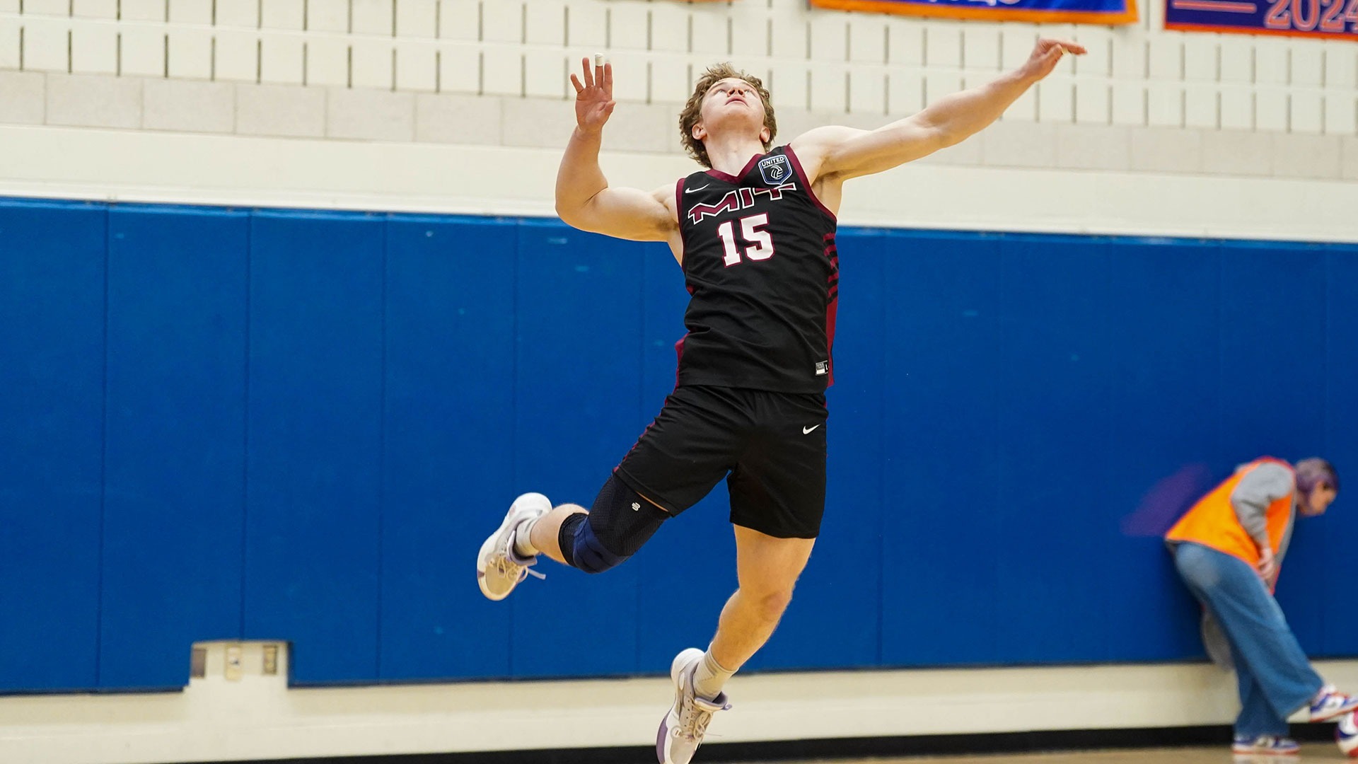 Braeden Baker going up for a serve 