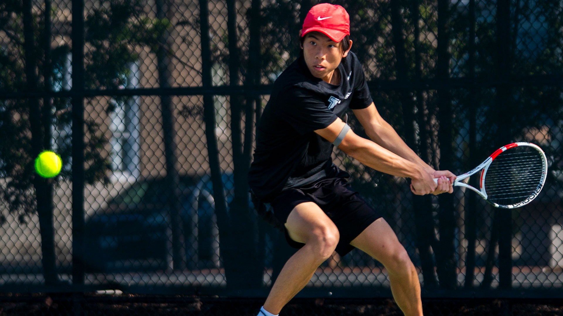 Hunter Liao hitting a tennis ball