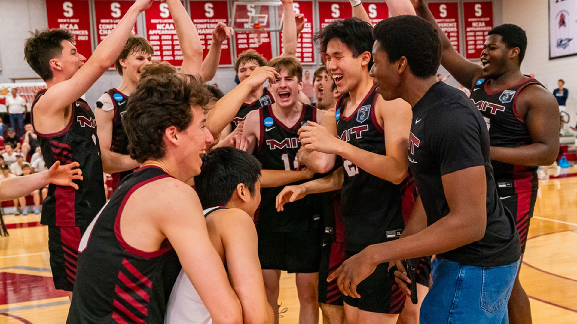 The Men's volleyball team celebrating