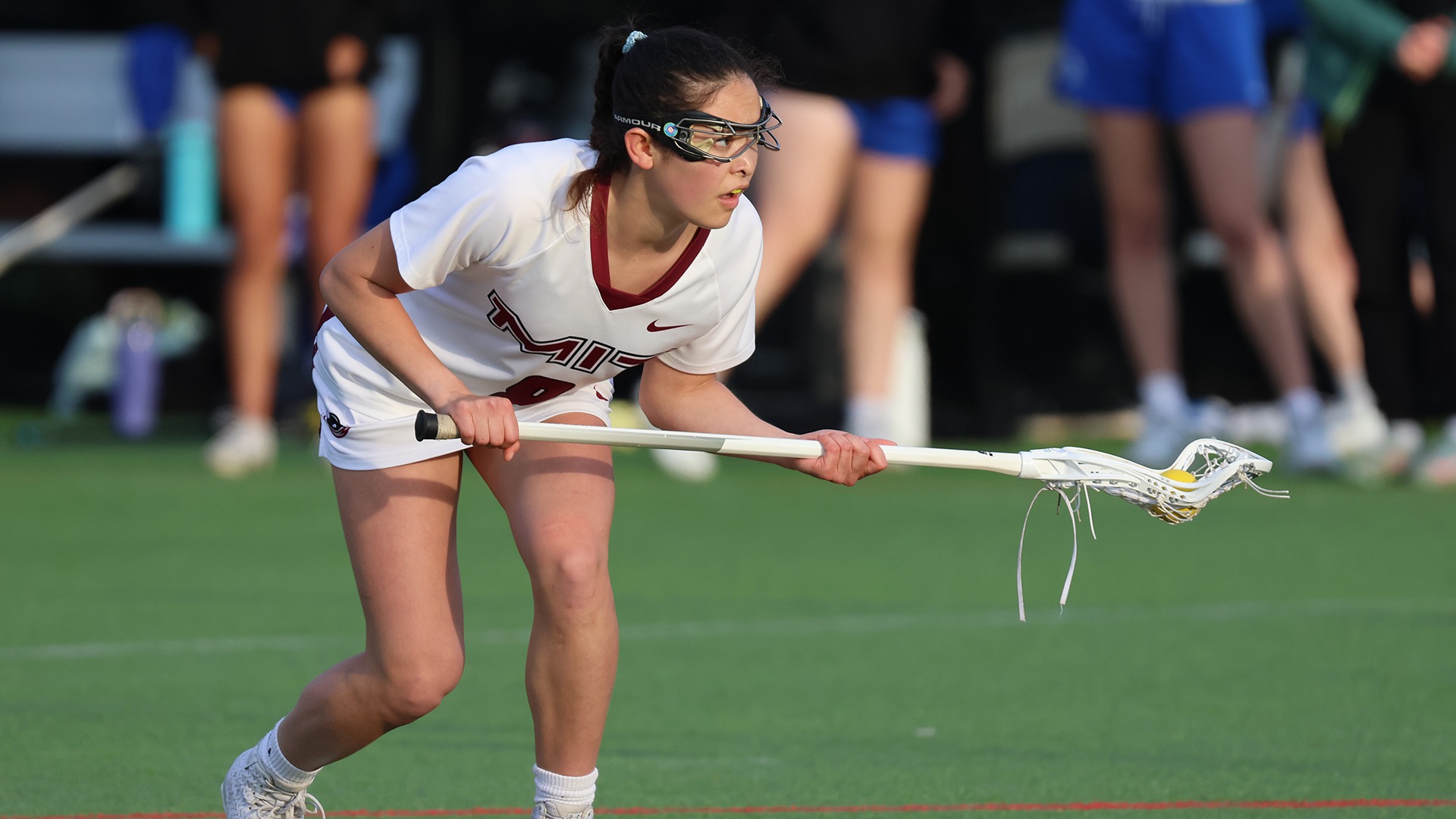 Nina Petulla standing with the ball in her lacrosse stick