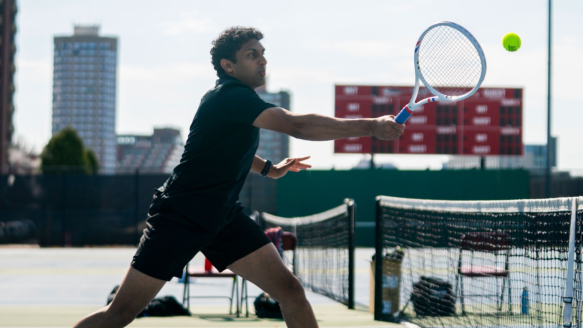 Rushil Patel hitting a tennis ball