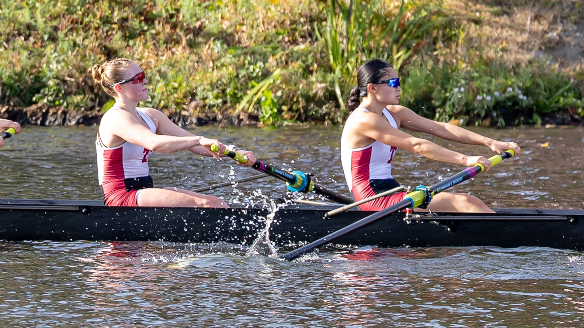 Anna Chan and Callie Karjane rowing for MIT