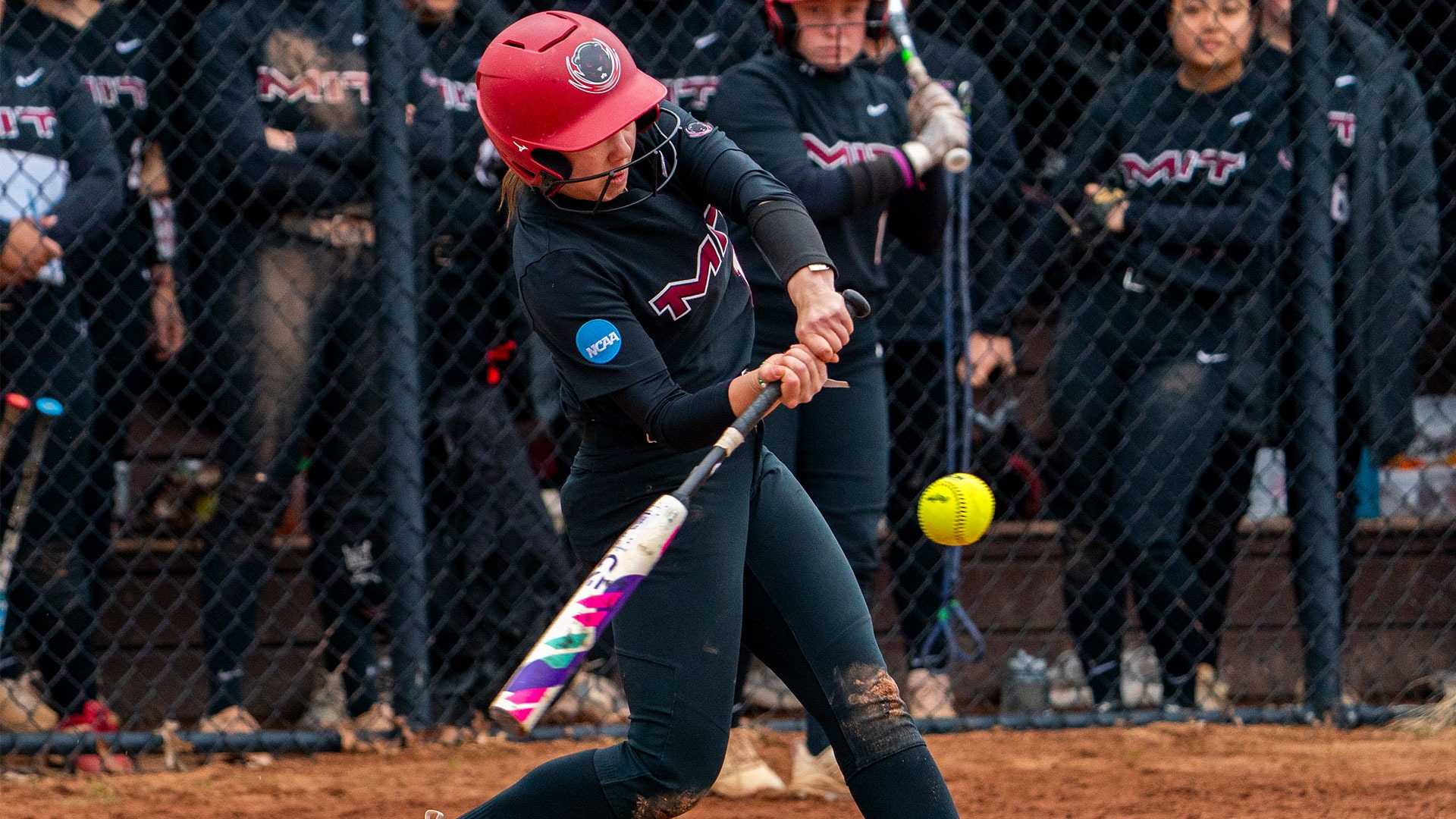 Maggie Feng swinging at a pitch