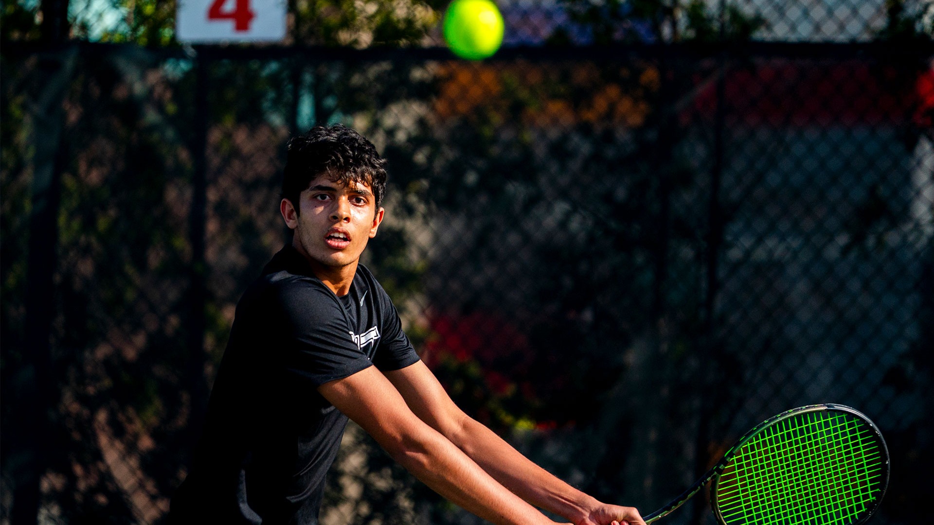 Siddharth Marathe getting ready to hit a tennis ball