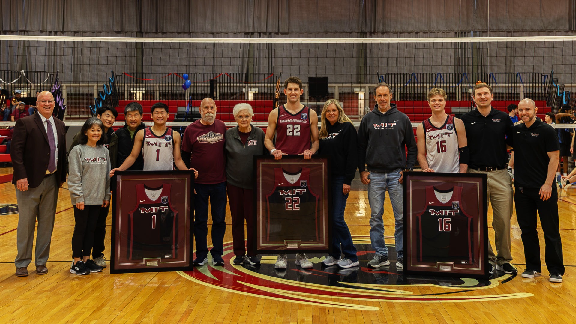 The MIT men's volleyball class of 2026 with their families and coaches